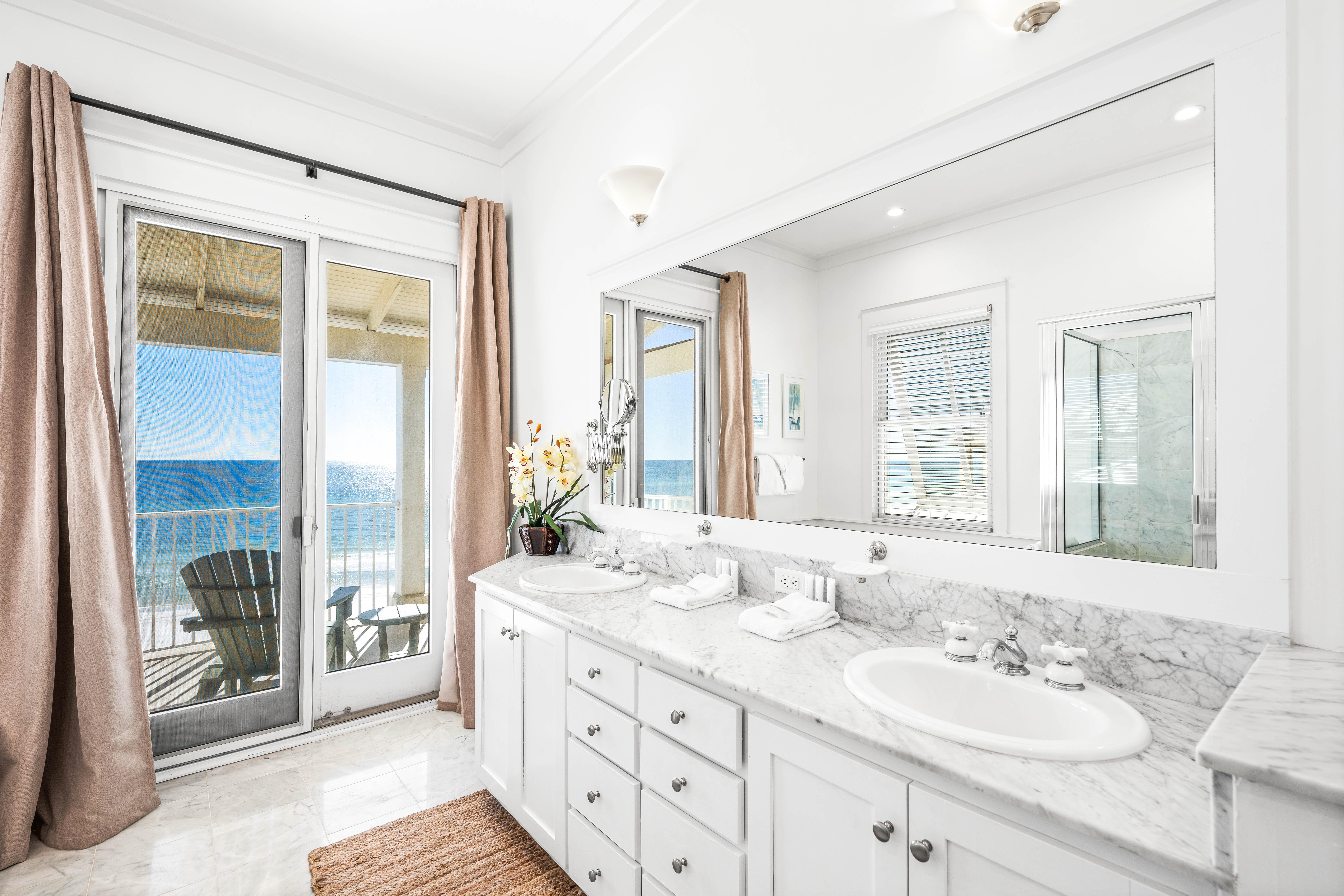 Walk-in shower, jetted tub, two sinks, marble vanity and one stunning view!   This is your primary bathroom on the 3rd floor and it is pure luxury.