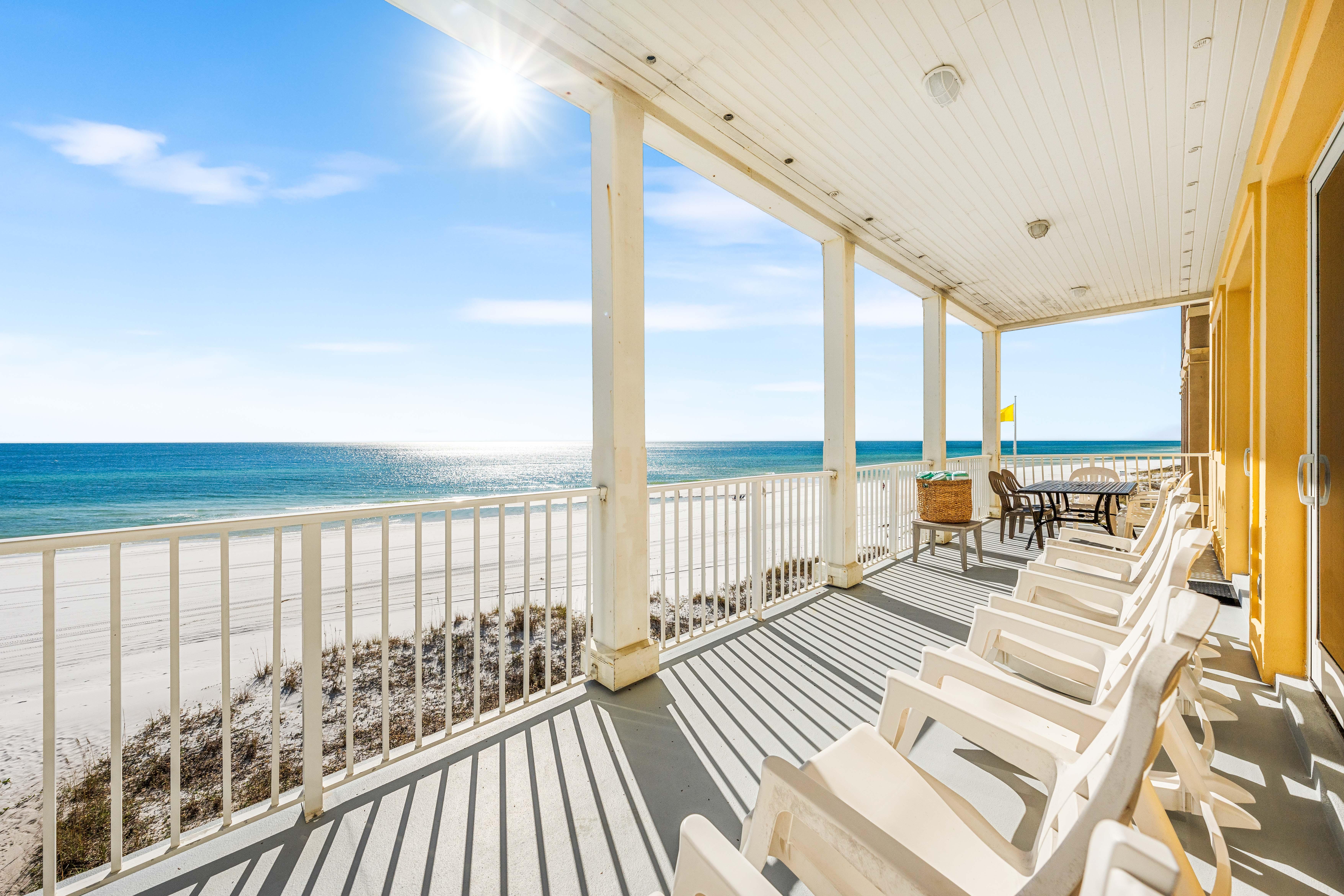 Rocking chairs plus an outdoor dining table on this 2nd floor balcony!