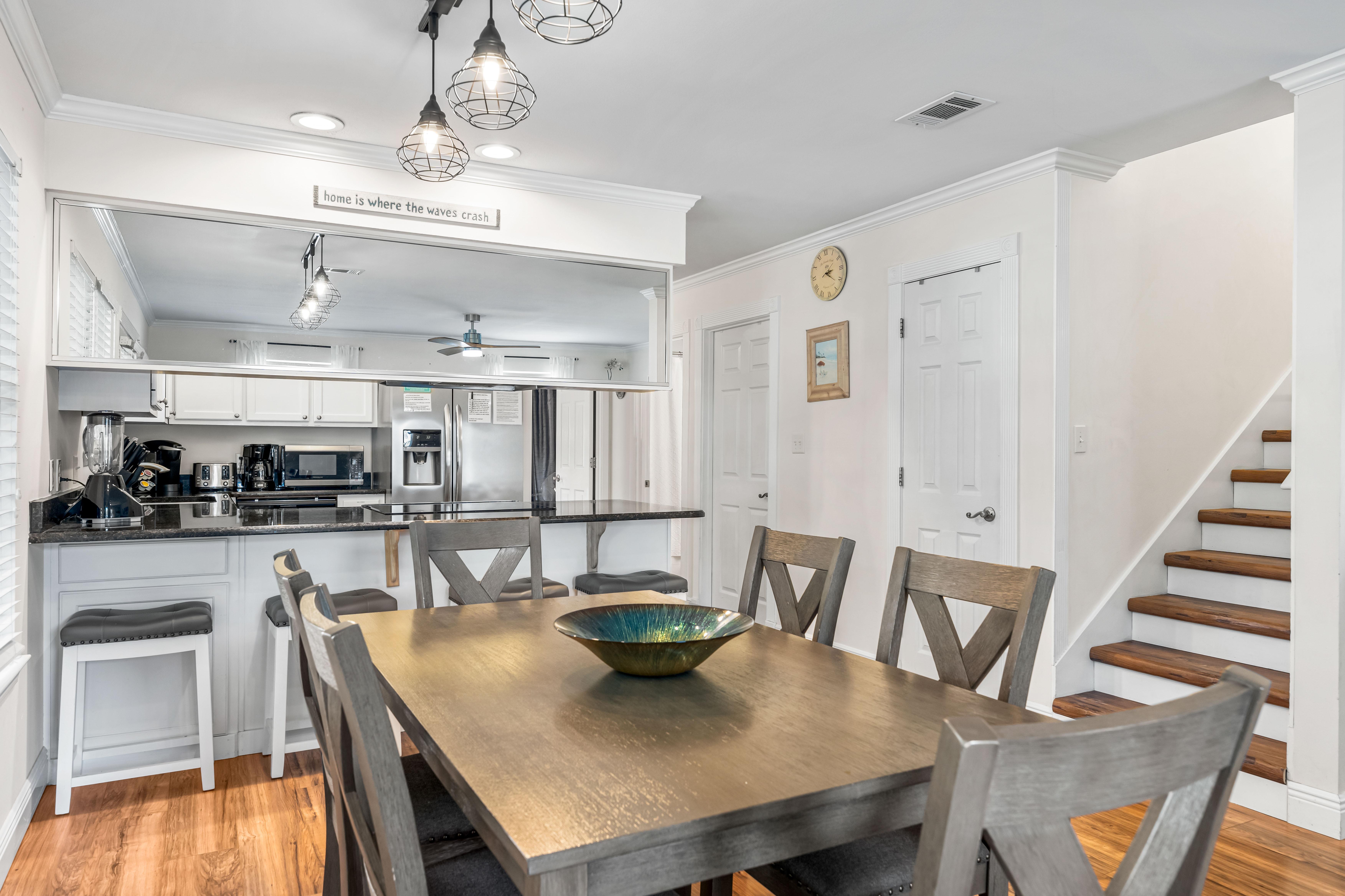 Seating at the dining table for 6 with 4 bar stools.
