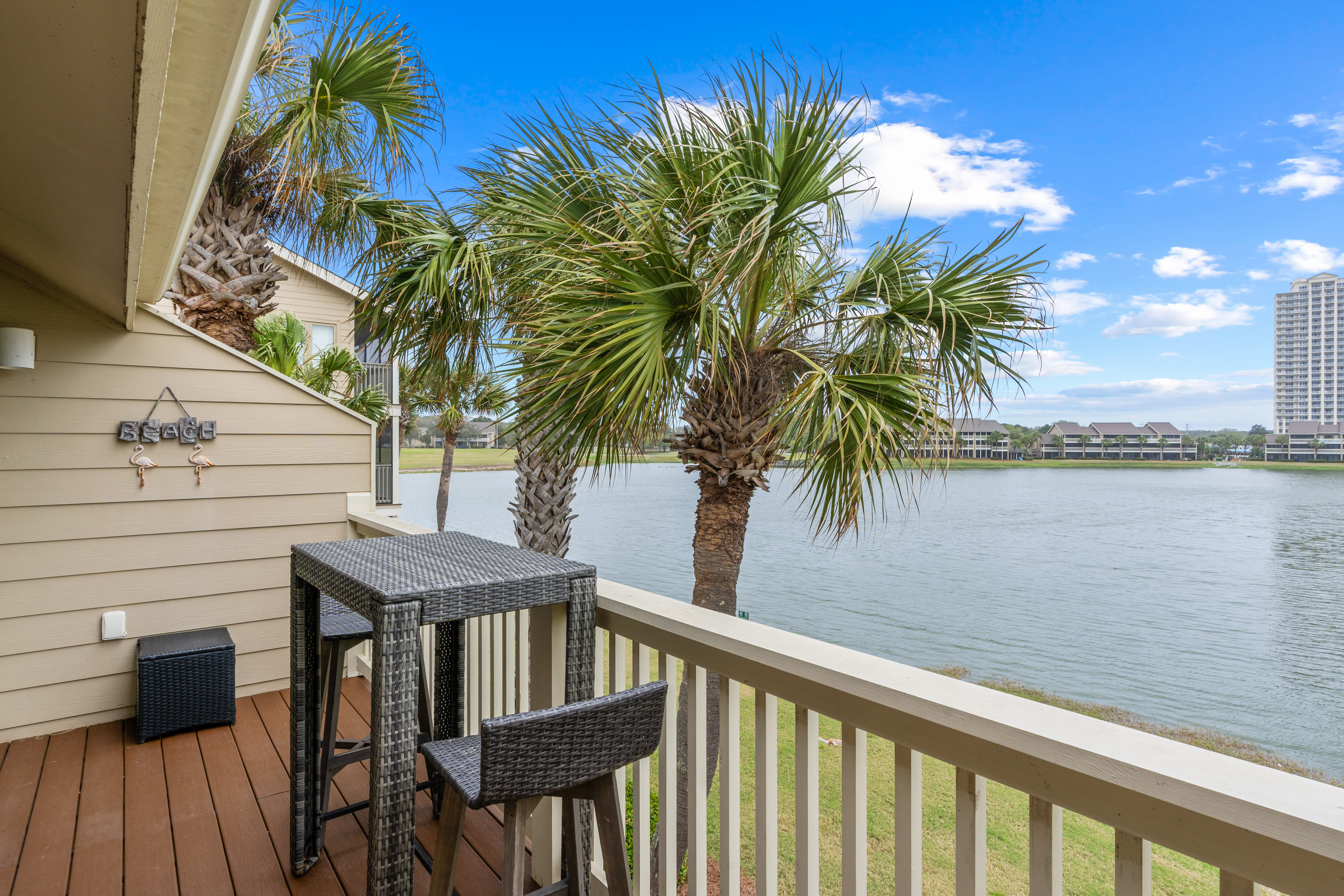 Sip your morning coffee on your private deck while watching palm trees sway over tranquil waters.