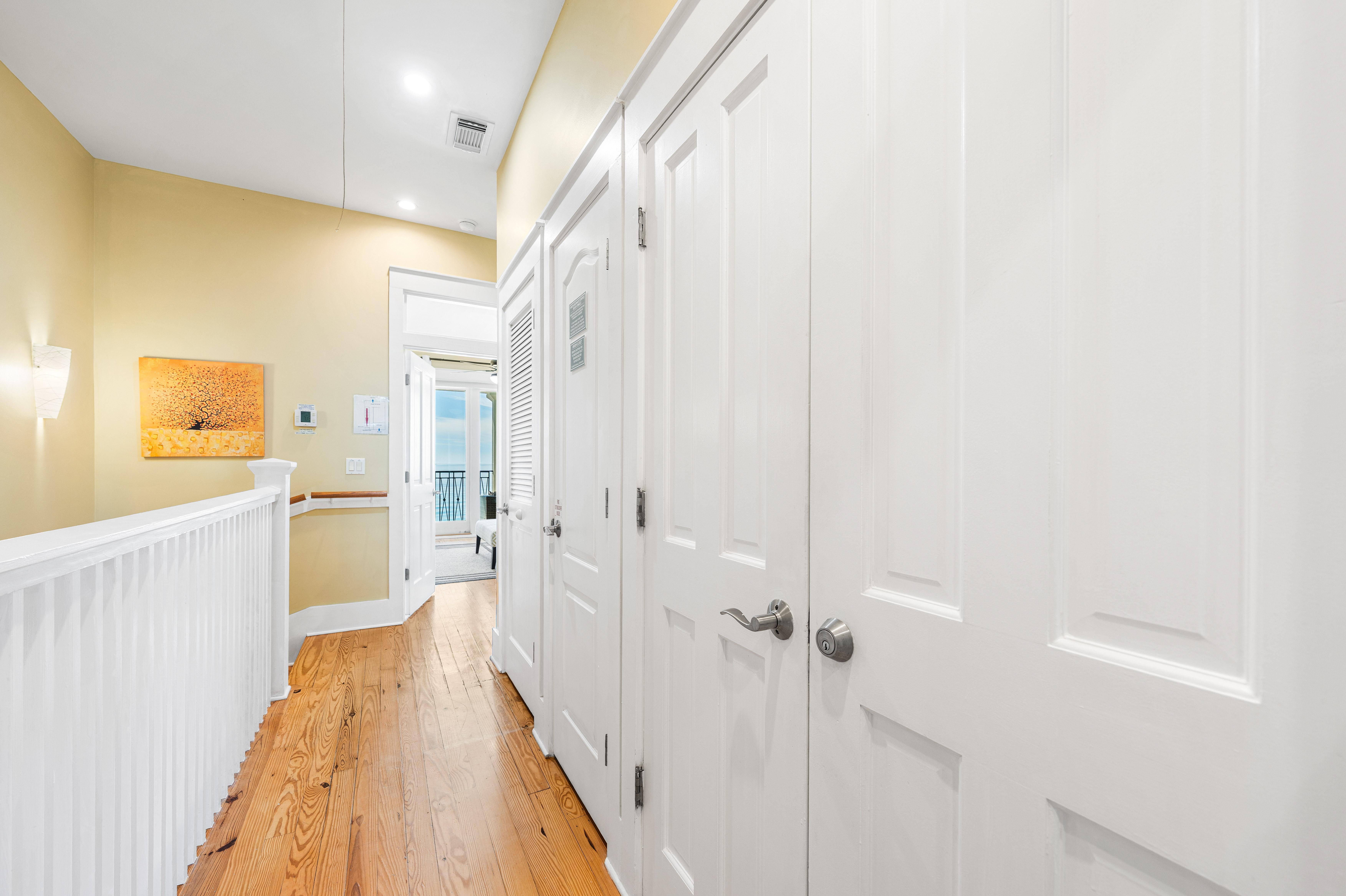 Third Floor Hallway connecting both the Primary King Bedroom and the Queen ensuite bedroom.