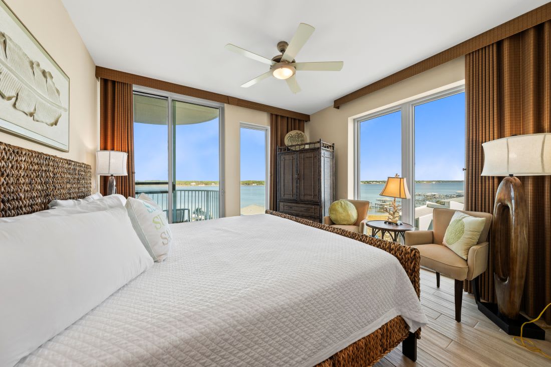 Wake up to stunning water views from your king bed, where morning light filters through floor-to-ceiling windows and gentle breezes flow.