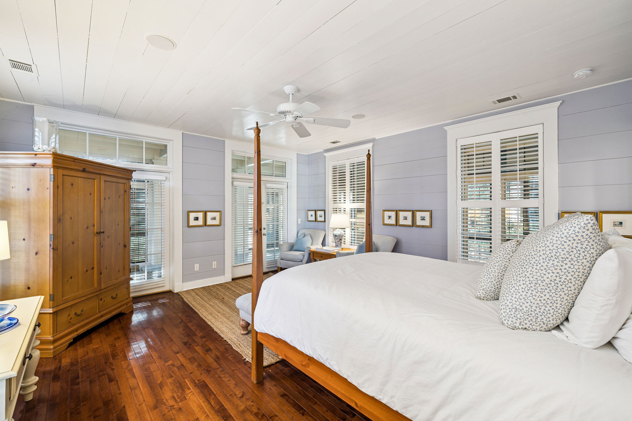 Primary Suite - Offering a Flat-Screen TV & Porch Access