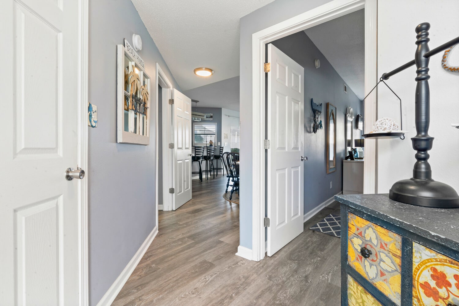 Step into your welcoming hallway where thoughtful touches and warm lighting create an inviting atmosphere that flows seamlessly throughout your home.