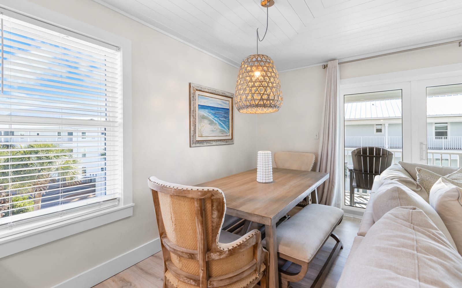 Gather around your stylish dining table where warm pendant lighting creates the perfect ambiance for memorable meals with loved ones.