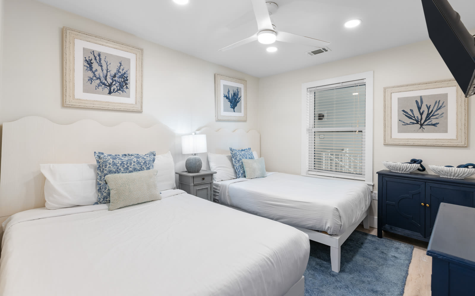 Drift off peacefully in your twin bed sanctuary, where coastal artwork and crisp linens create the perfect retreat after a day of adventure.