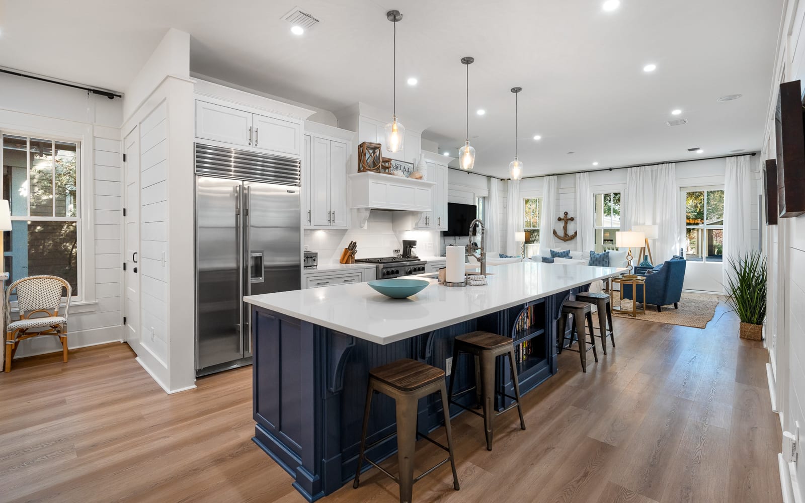 Your stunning open-concept kitchen flows seamlessly into the living area, featuring stainless steel appliances and a spacious island perfect for meal prep.