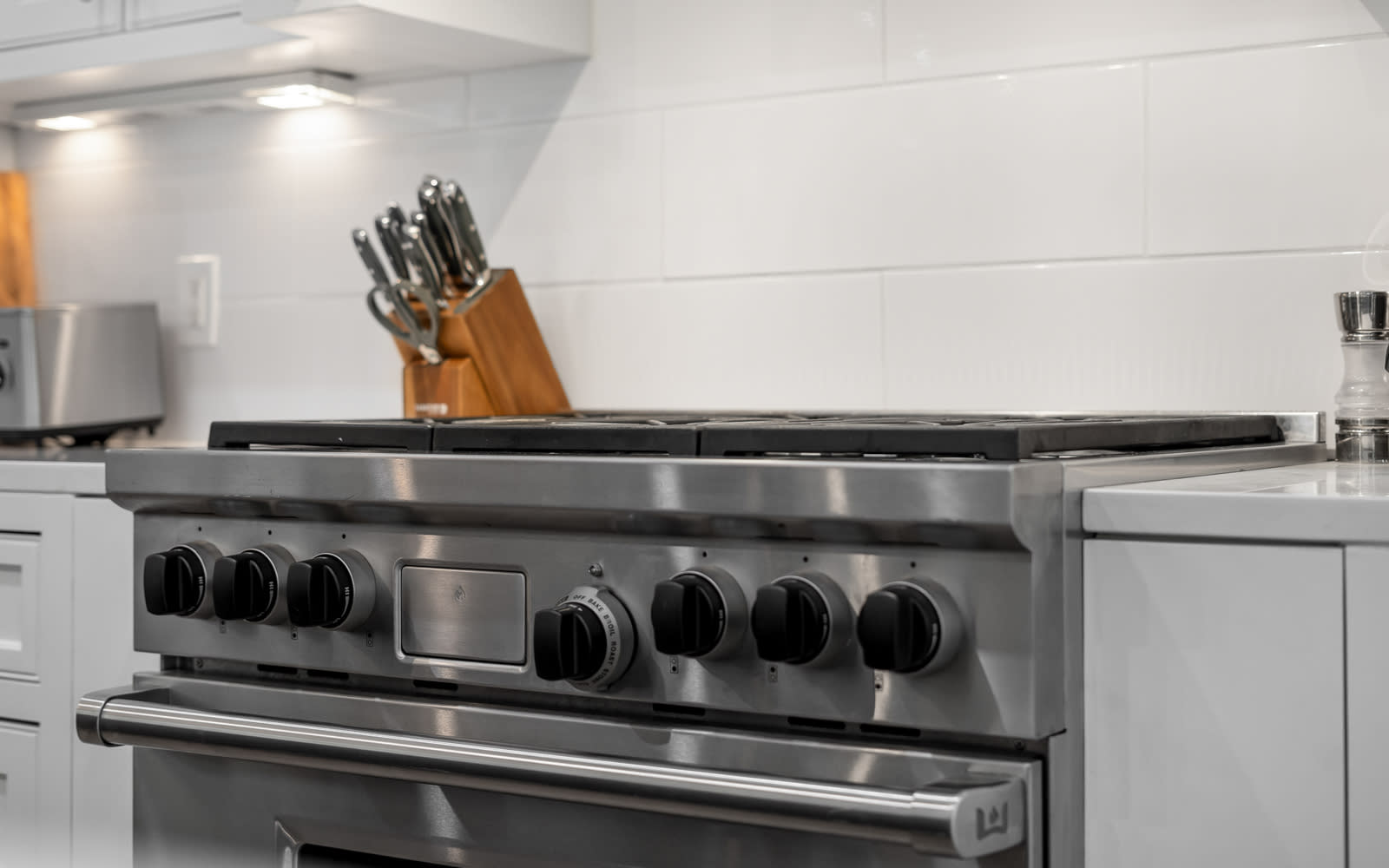 Your culinary adventures await in this sleek, modern kitchen featuring professional-grade appliances and thoughtfully organized workspace.