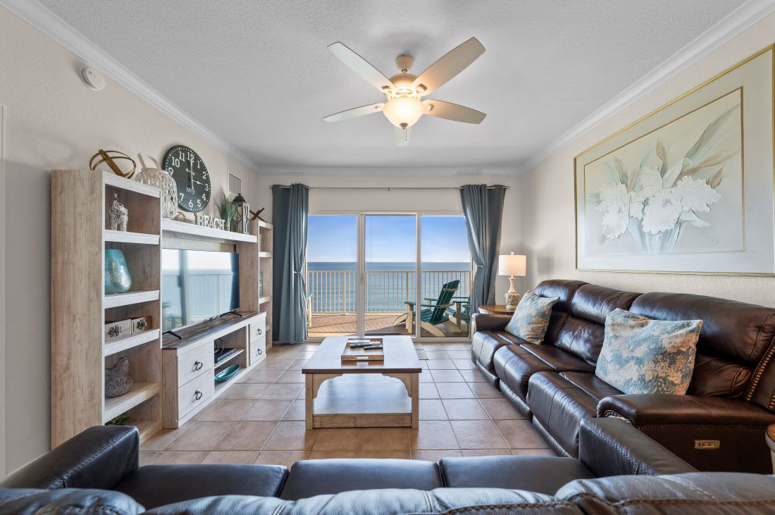 Unwind in your oceanfront living room where leather seating faces stunning sea views through floor-to-ceiling windows.