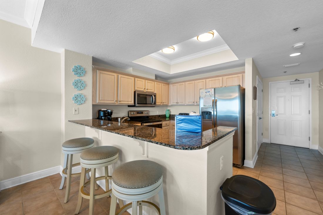 Your open kitchen features granite countertops, stainless steel appliances, and a breakfast bar perfect for morning coffee or casual dining together.