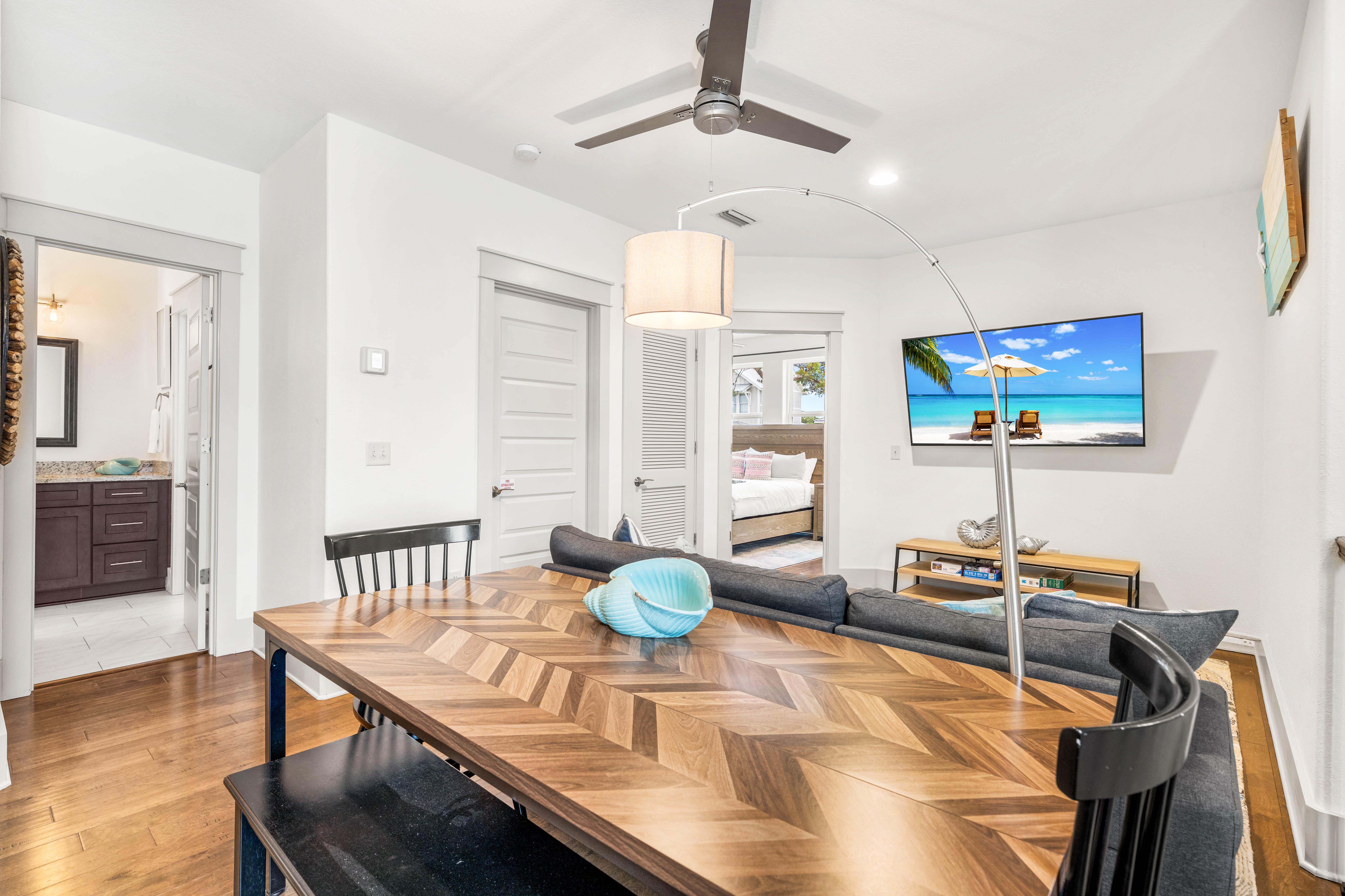 2nd floor bonus living area with kids in mind!  Table for 6 perfect for games or puzzles.  Sofa & 65" Smart TV with Cable Also!!