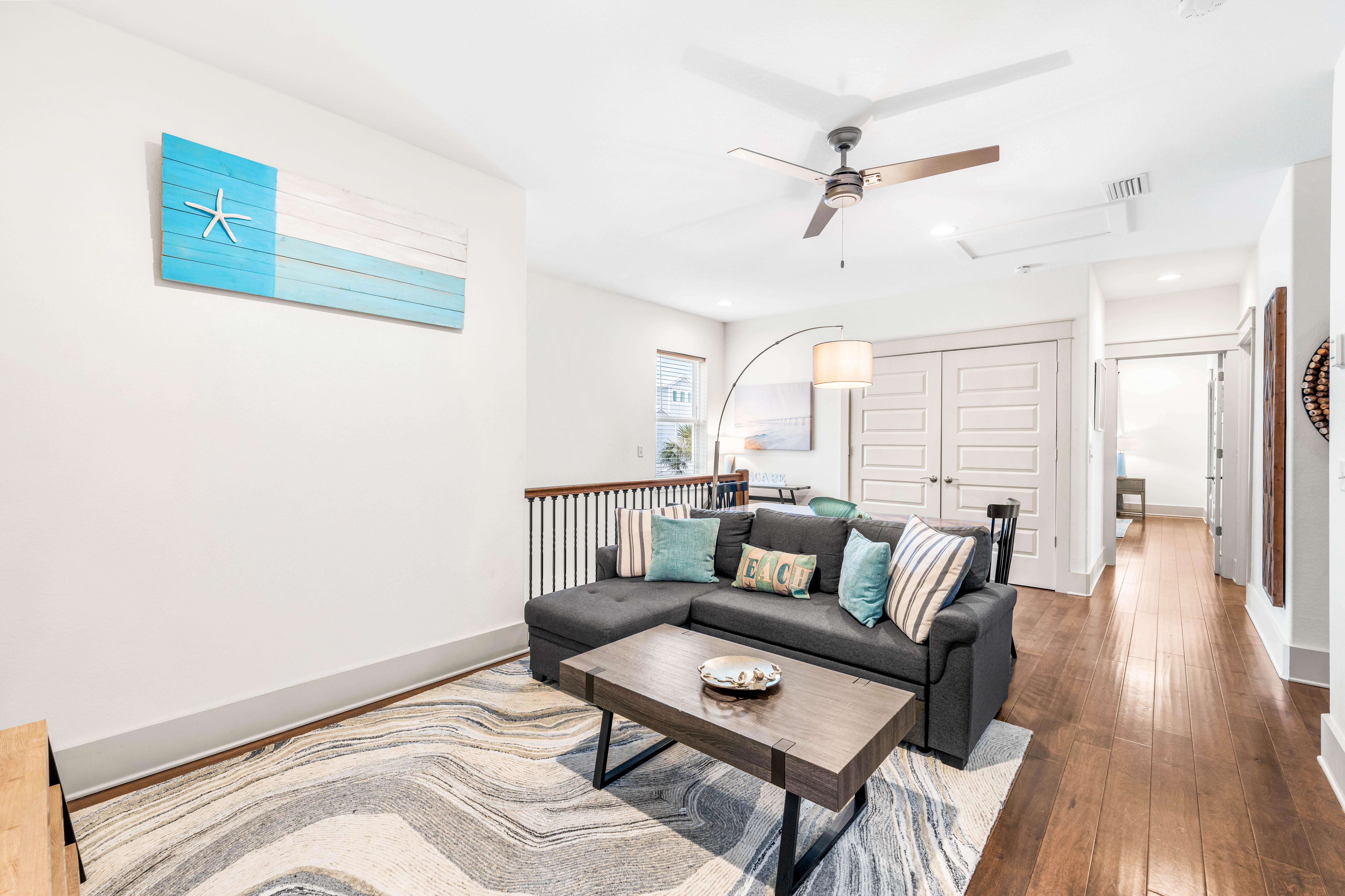 2nd floor bonus living area with kids in mind!  Table for 6 perfect for games or puzzles.  Sofa & 65" Smart TV with Cable Also!!