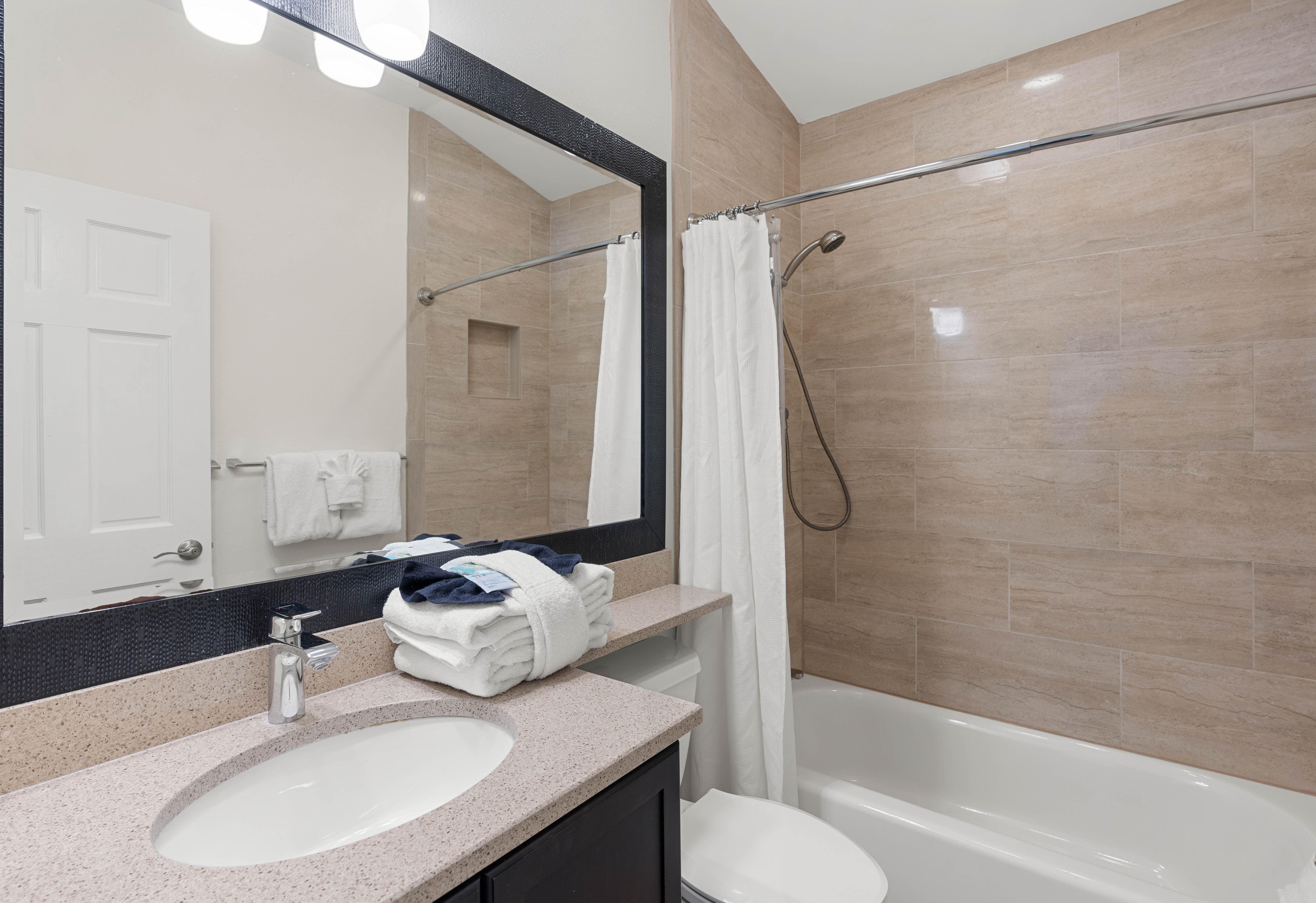 Second floor guest bathroom with tub and shower combo