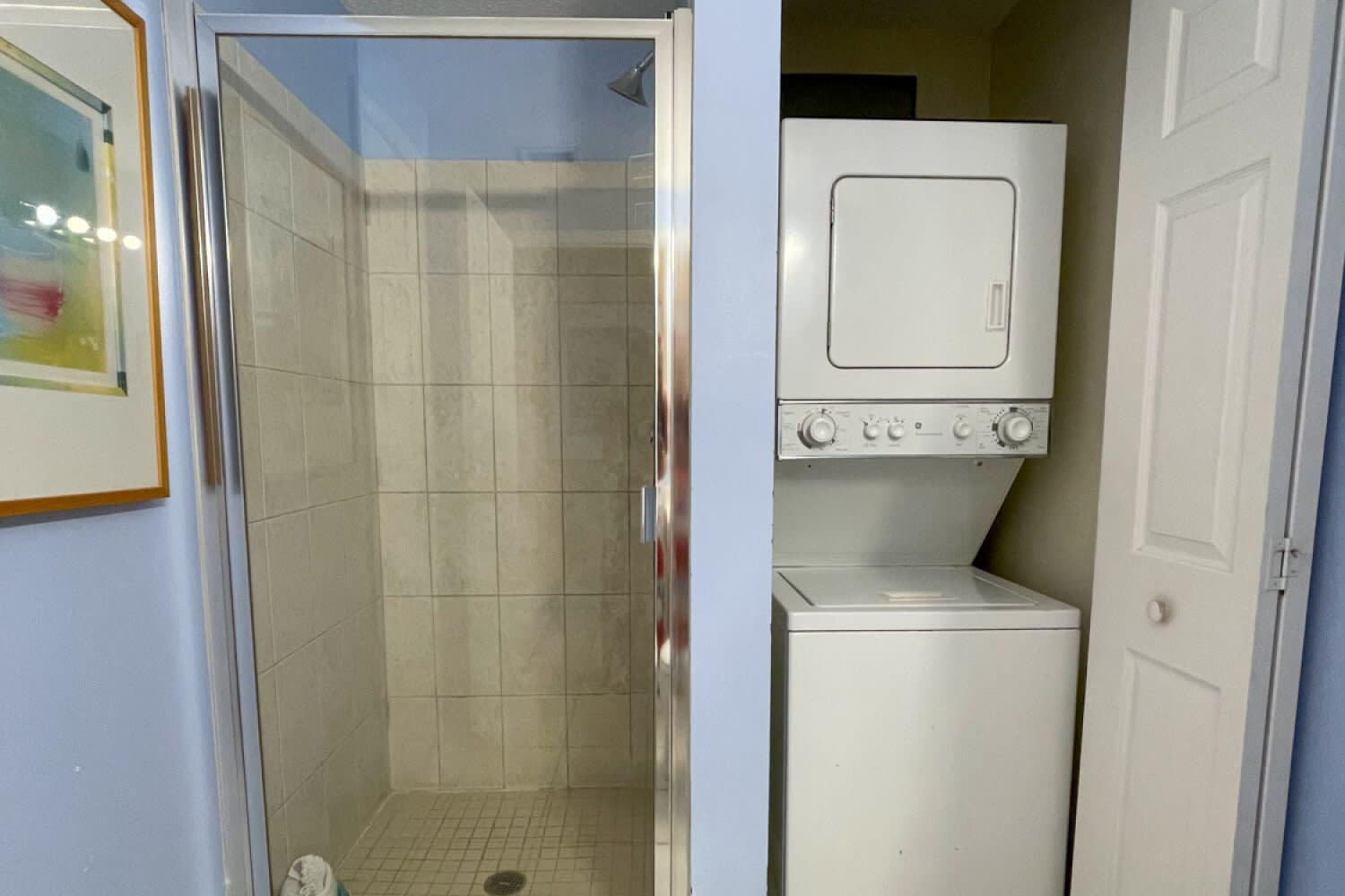 Guest bathroom with a washer and dryer.