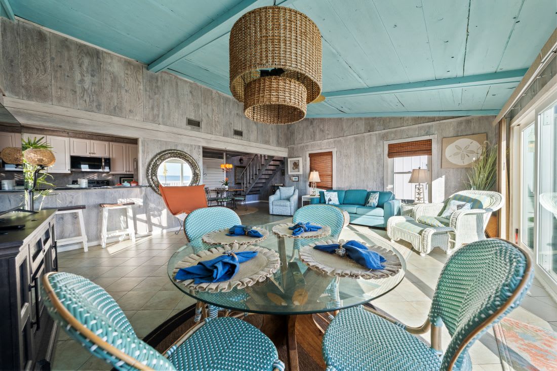 Gather around your bright, airy dining space with coastal blues and natural textures creating the perfect setting for memorable meals together.