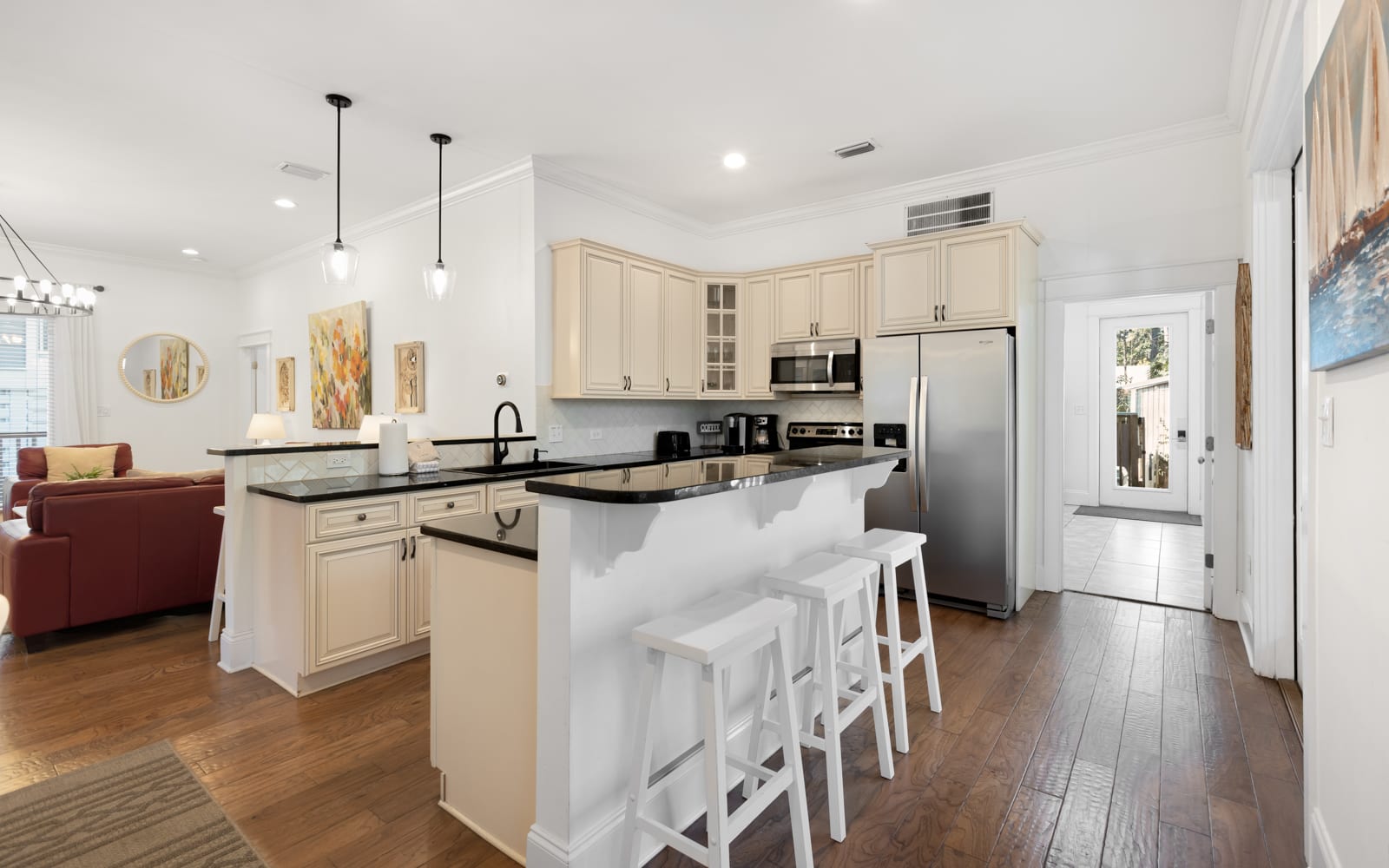 Your fully equipped kitchen invites culinary adventures with granite counters, stainless appliances, and a breakfast bar perfect for morning coffee.
