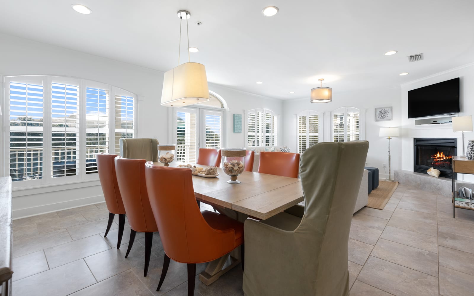 Gather around your stylish dining table where warm leather chairs invite memorable meals and conversation.