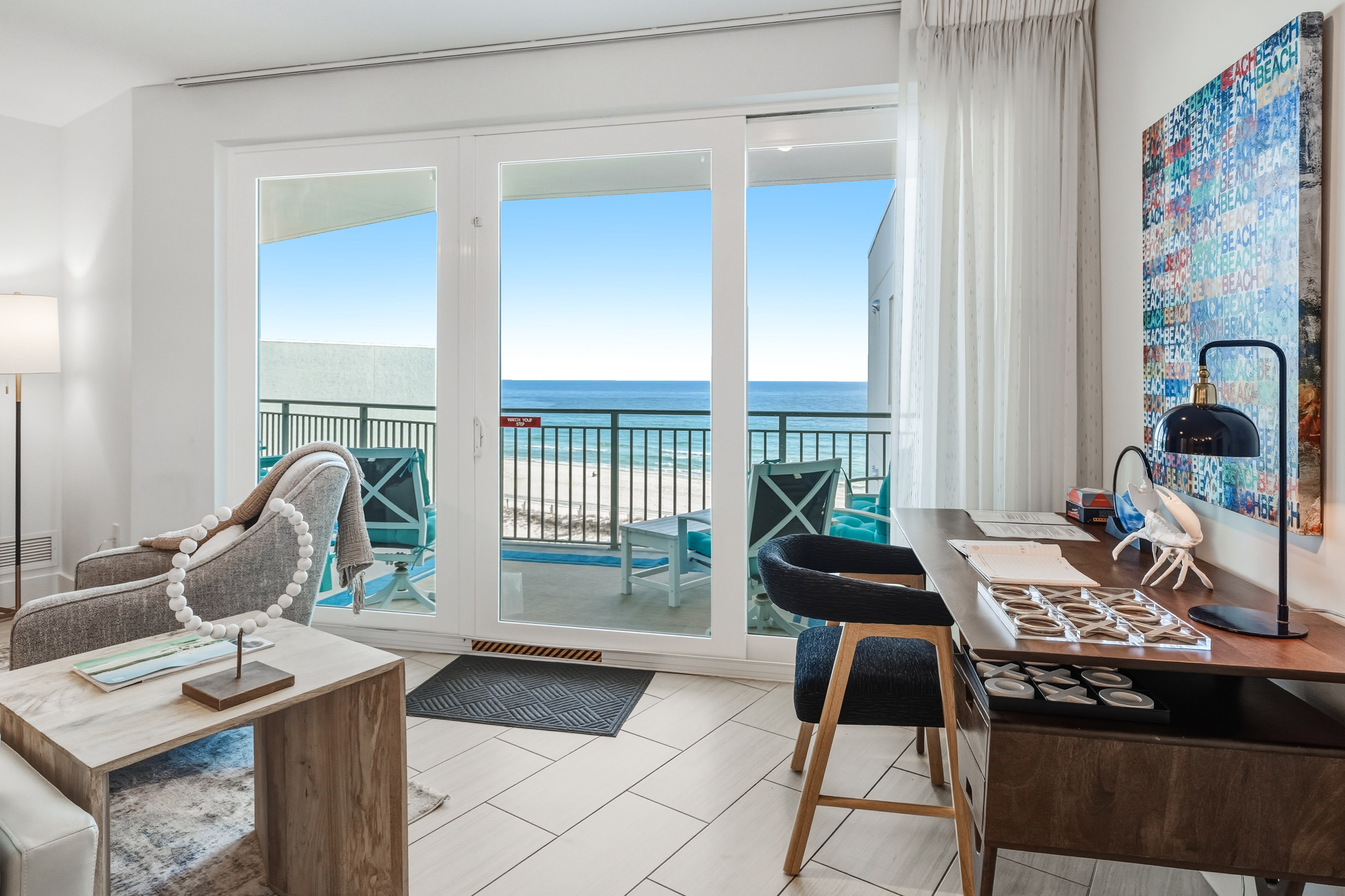 Your oceanfront retreat features floor-to-ceiling windows framing stunning sea views from your stylish living space.