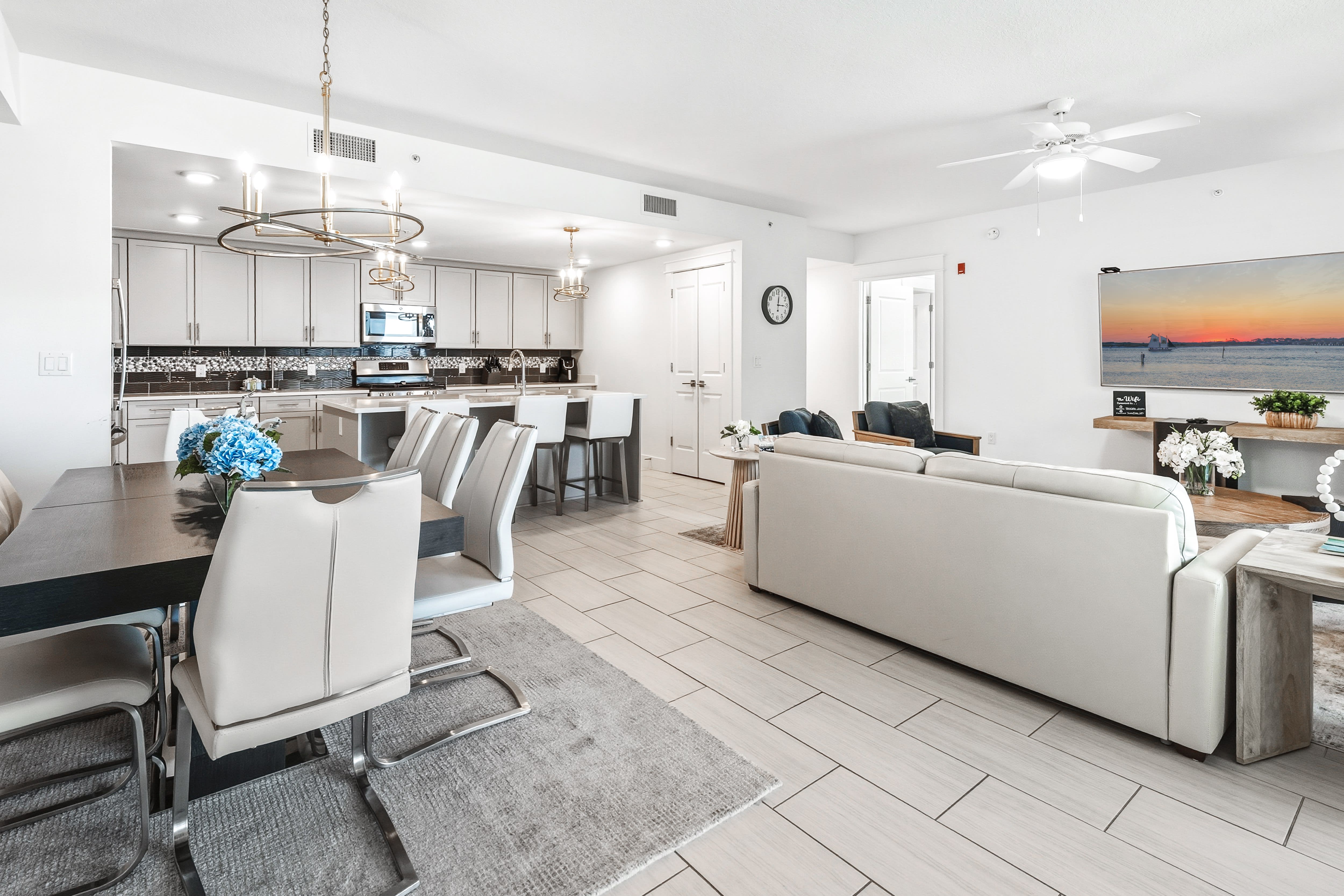 Step into your bright, modern retreat where sleek finishes and open living create the perfect backdrop for memorable evenings together.