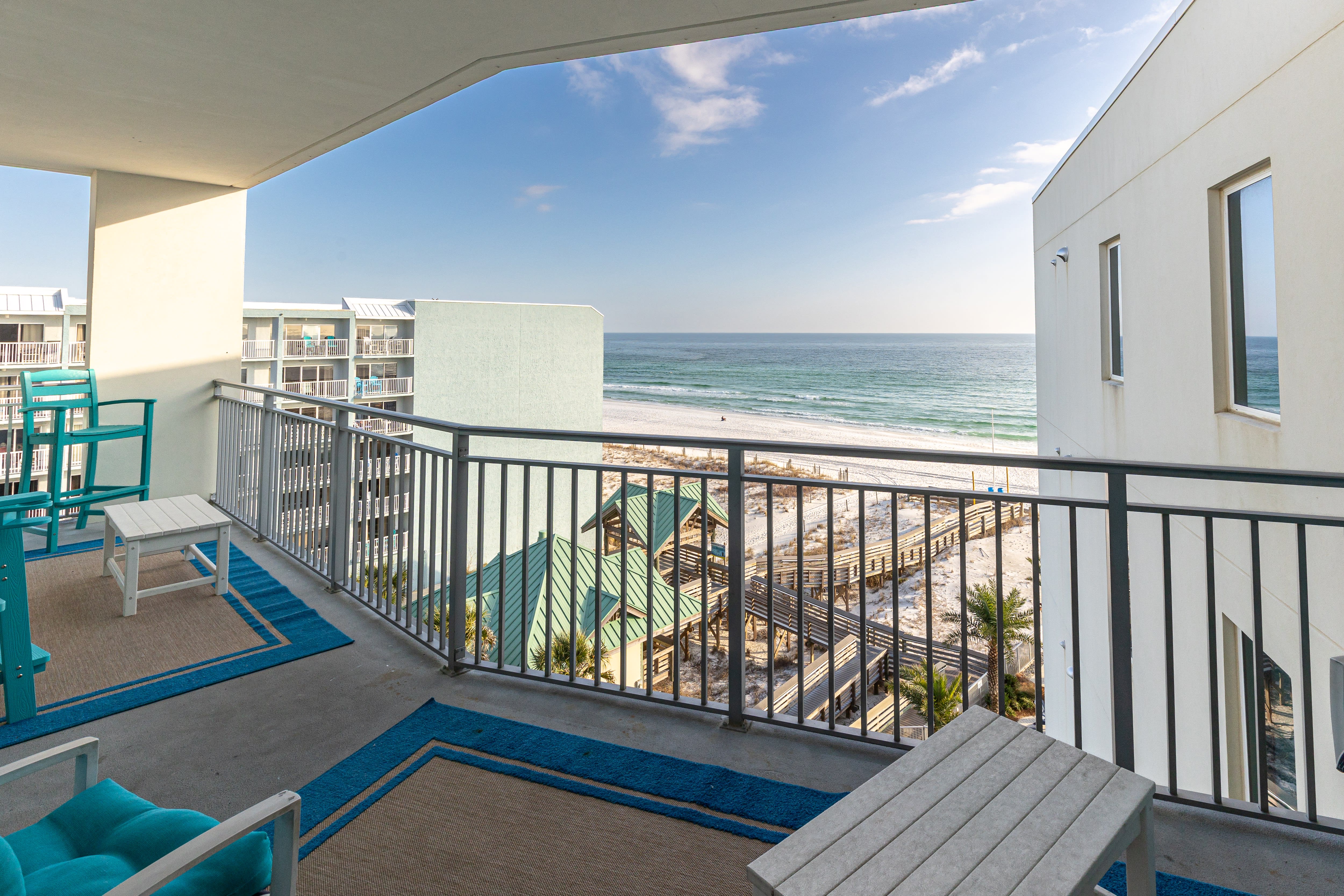 Wake up to breathtaking ocean views from your private balcony, where turquoise waters meet endless sky just steps away.