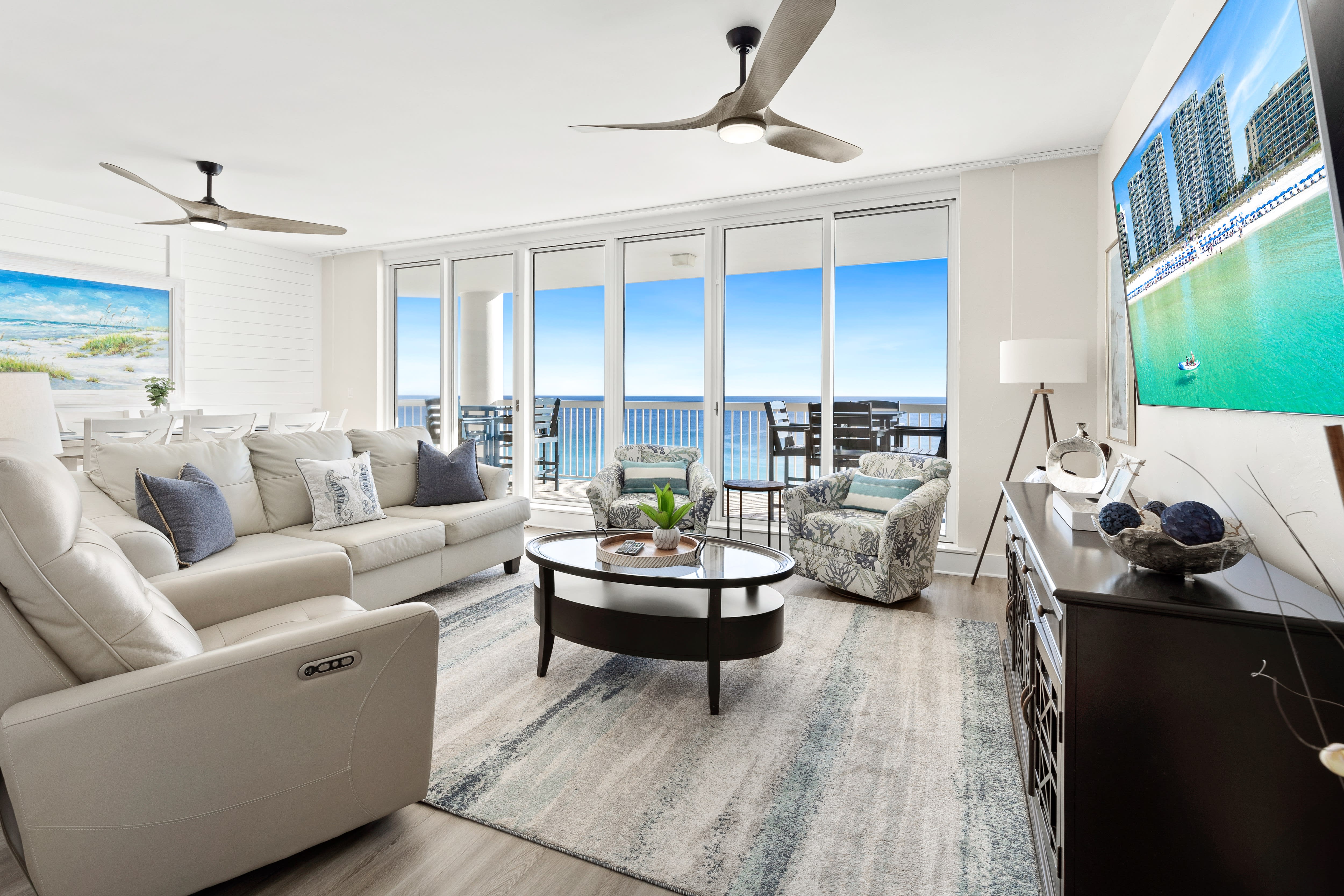 Sink into plush seating with stunning ocean views stretching endlessly before you through floor-to-ceiling windows.