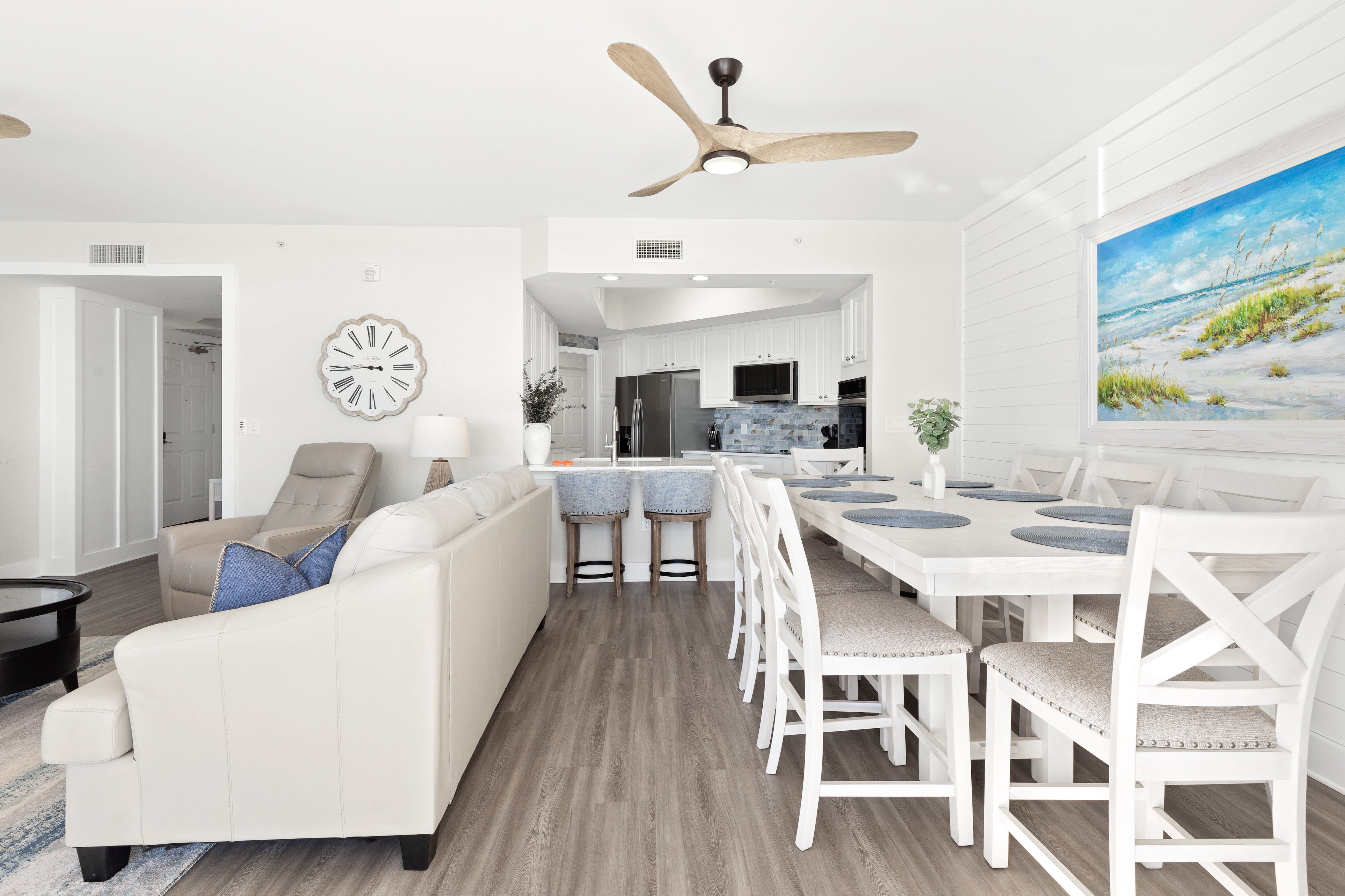 Relax in your bright, open living space where coastal charm meets modern comfort, complete with a fully equipped kitchen for your convenience.