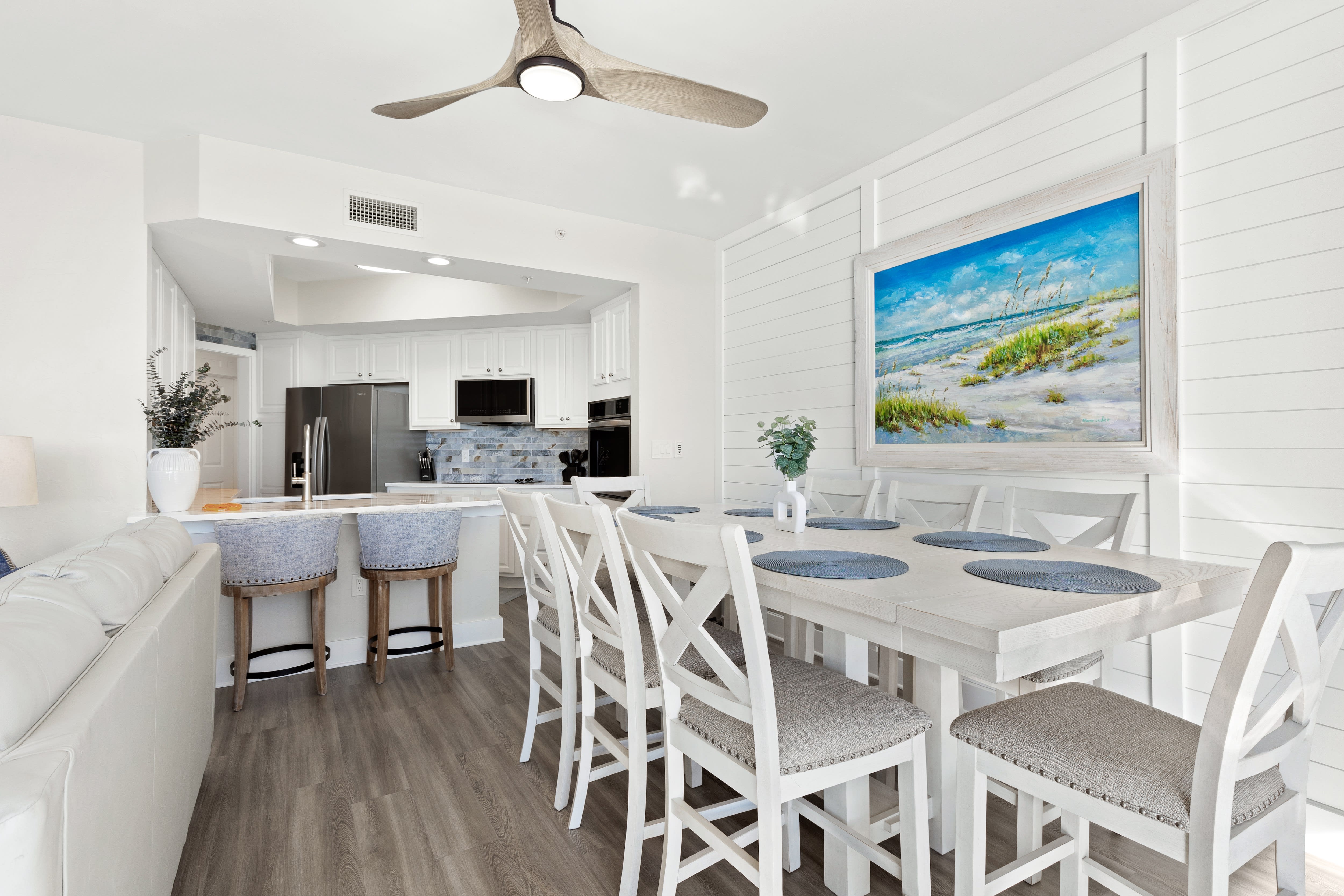 Gather around your spacious dining table while coastal artwork sets the mood, then enjoy cooking in your fully-equipped modern kitchen.