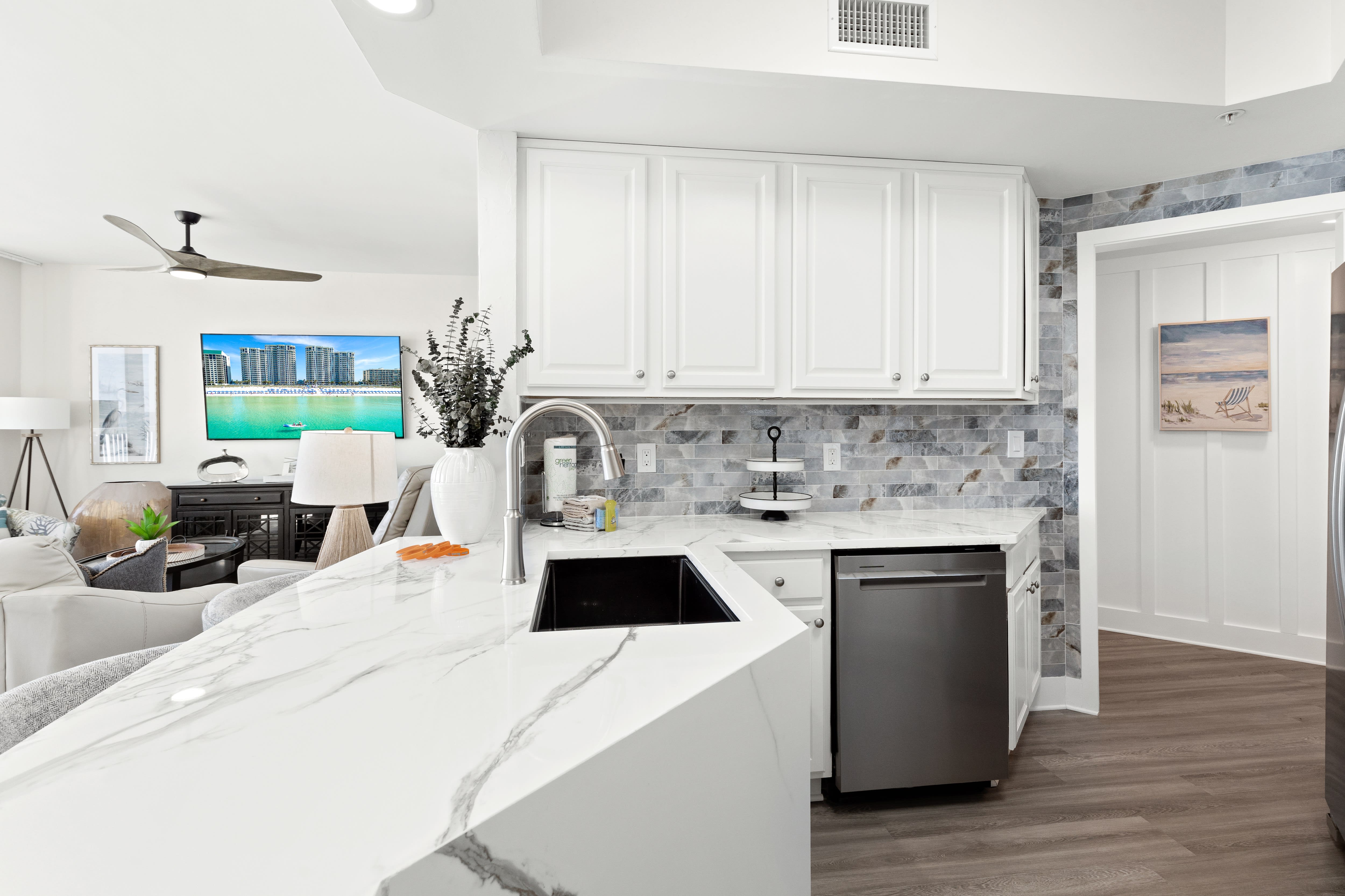 Your modern kitchen features marble countertops, stainless steel appliances, and stylish tile backsplash for effortless cooking.