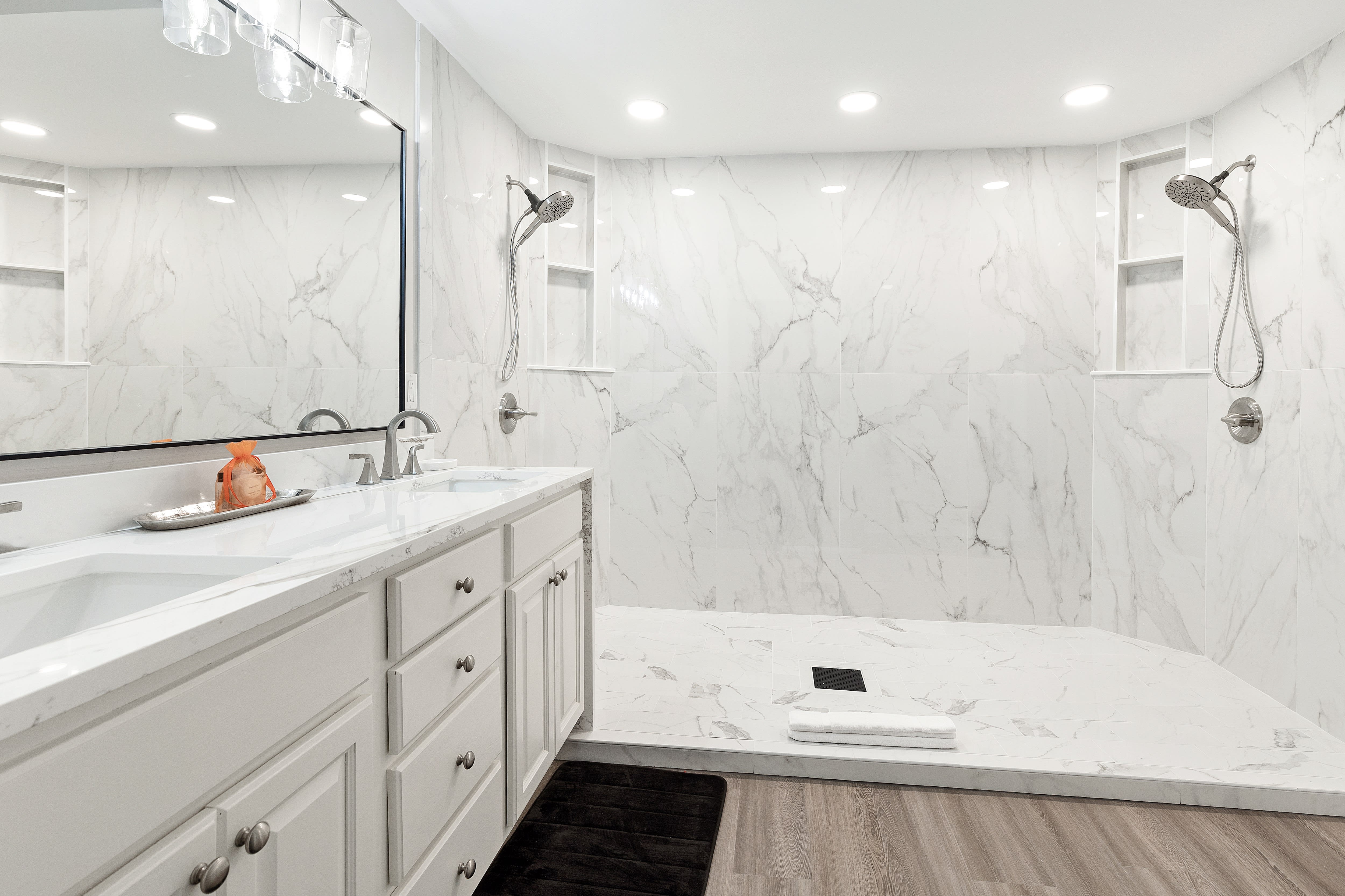 Step into your luxurious marble sanctuary with a soaking tub and rainfall shower—perfect for unwinding after exploring.