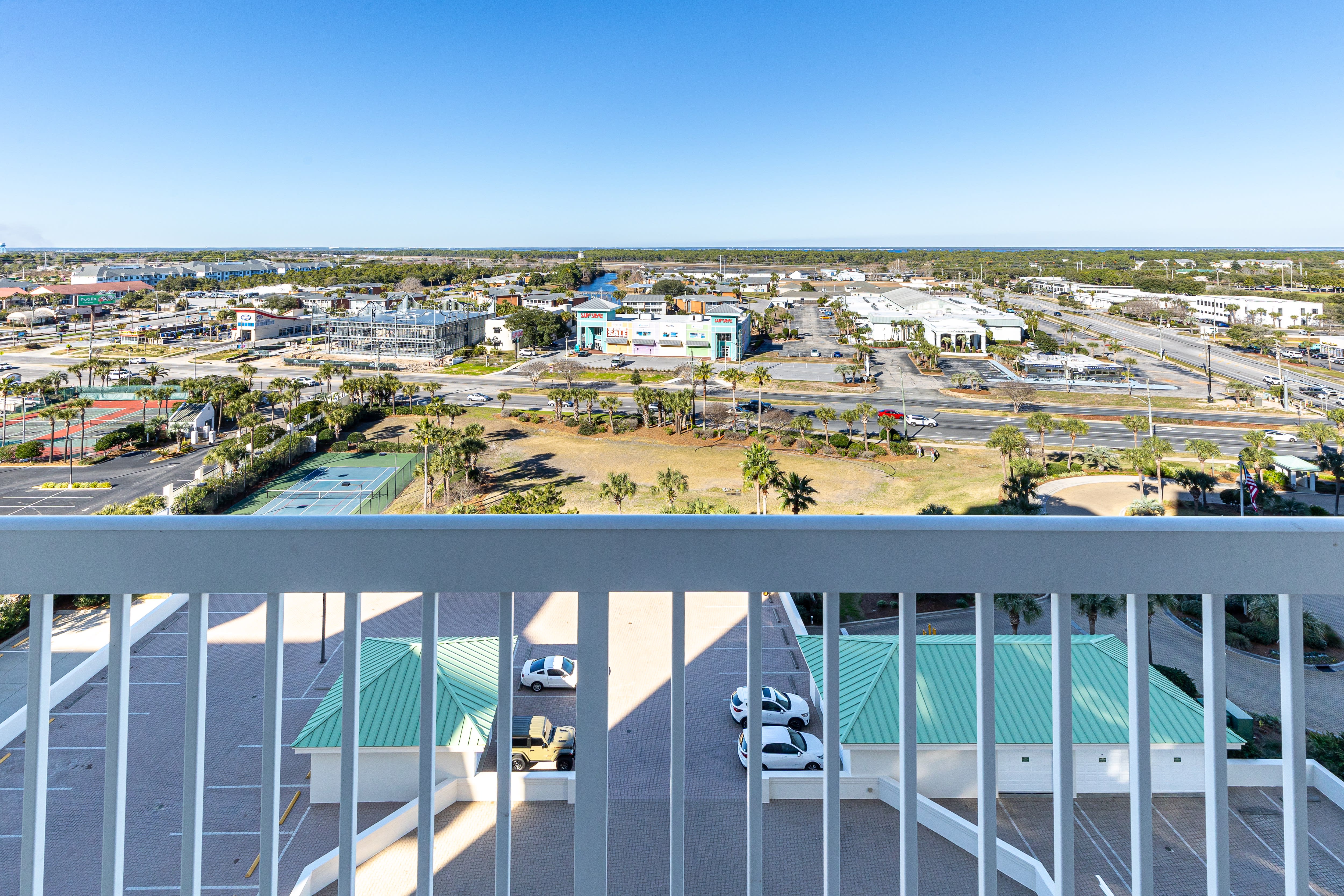 Aerial view shows the bustling community and convenient location surrounding this coastal area property.