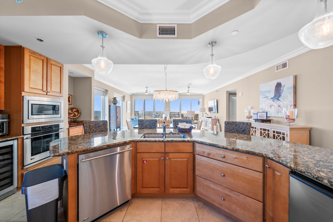 Your gourmet kitchen features granite countertops, stainless appliances, and stunning views perfect for cooking memorable meals.