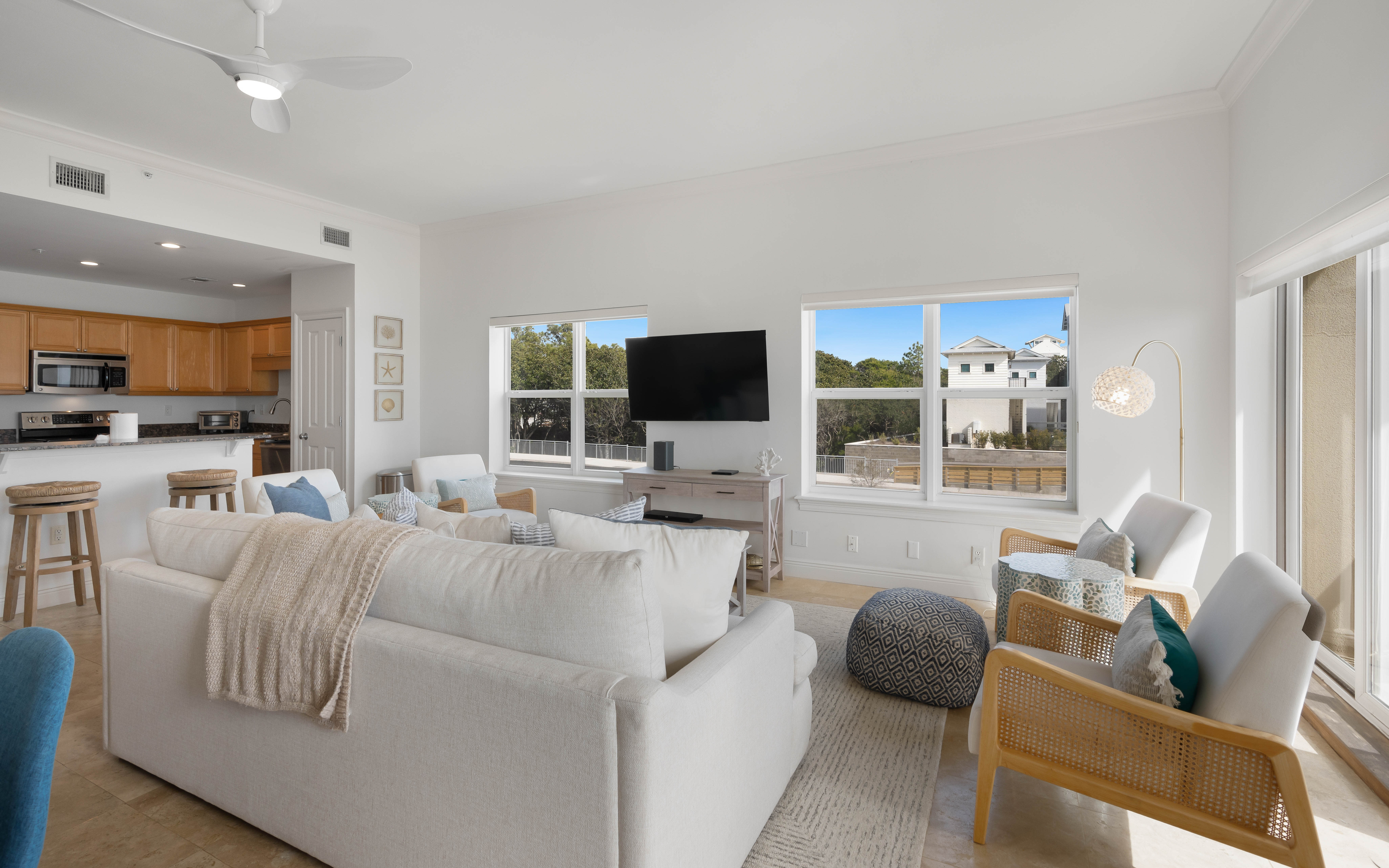 Sink into plush seating while enjoying your favorite shows on the wall-mounted TV in this bright, open living space.