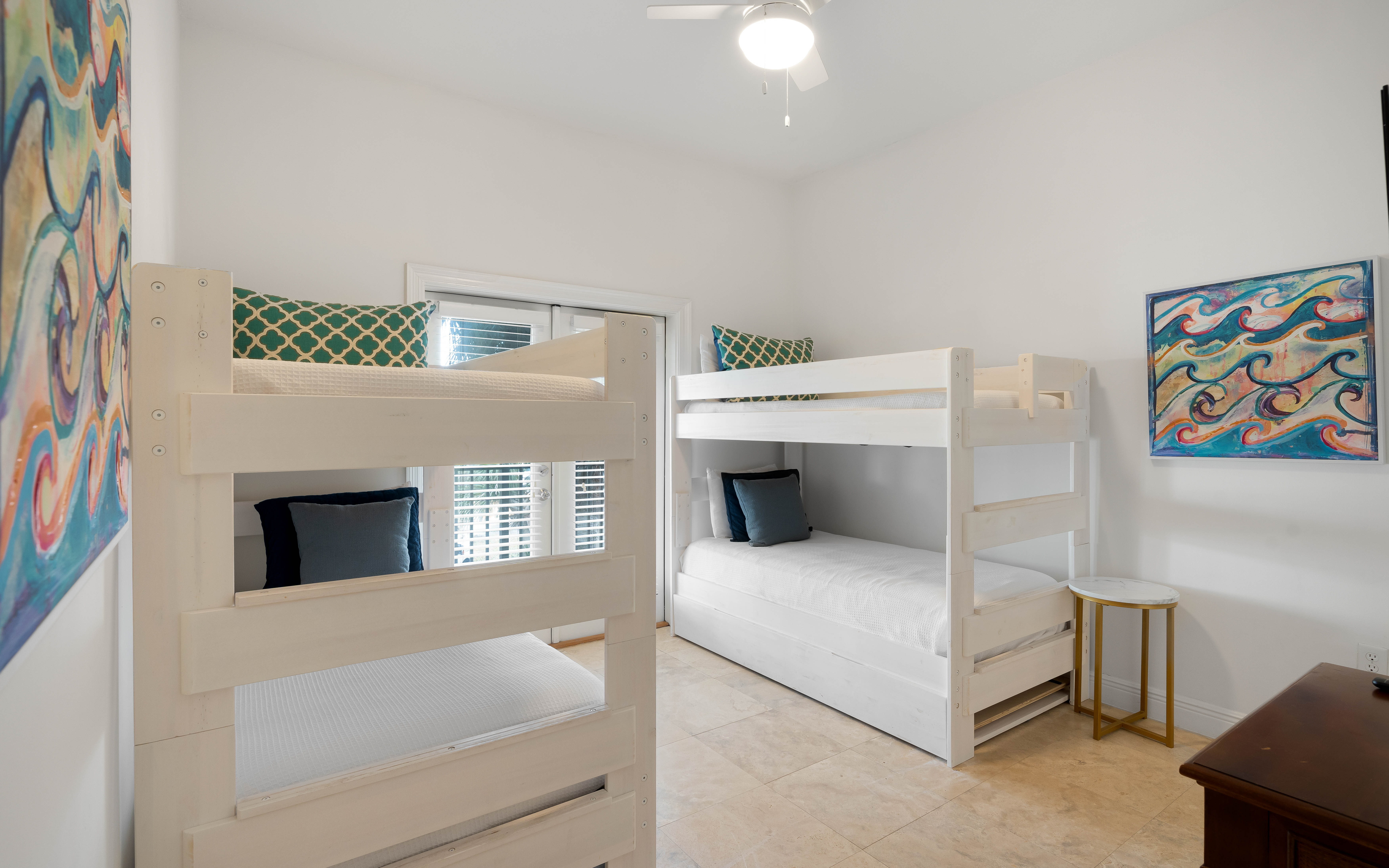 Your kids will love these cheerful bunk beds, perfectly set up for a cozy night's sleep after beach adventures.