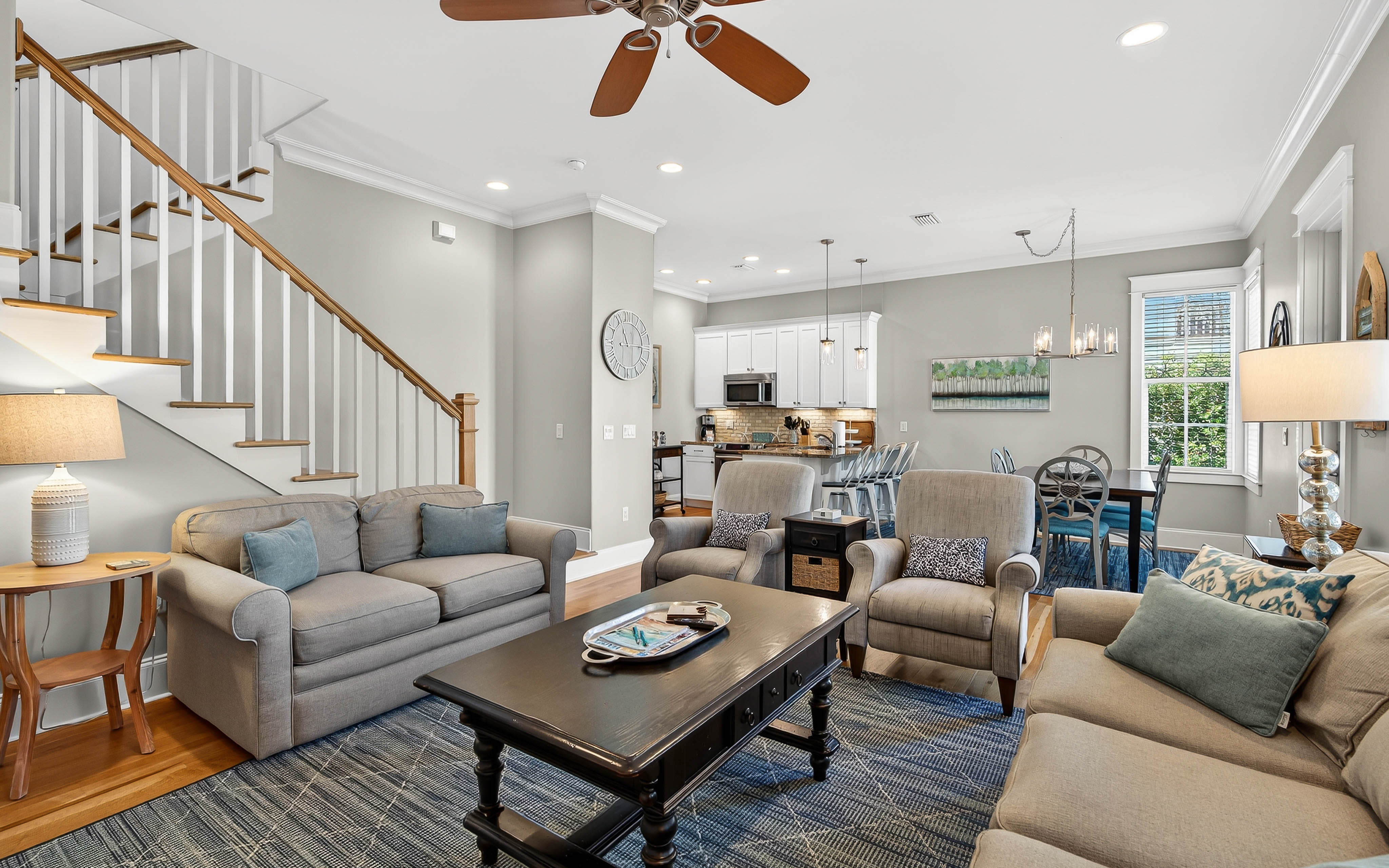 Relax in your spacious open-plan living area with comfortable seating, modern kitchen, and stylish touches that make this feel like home.