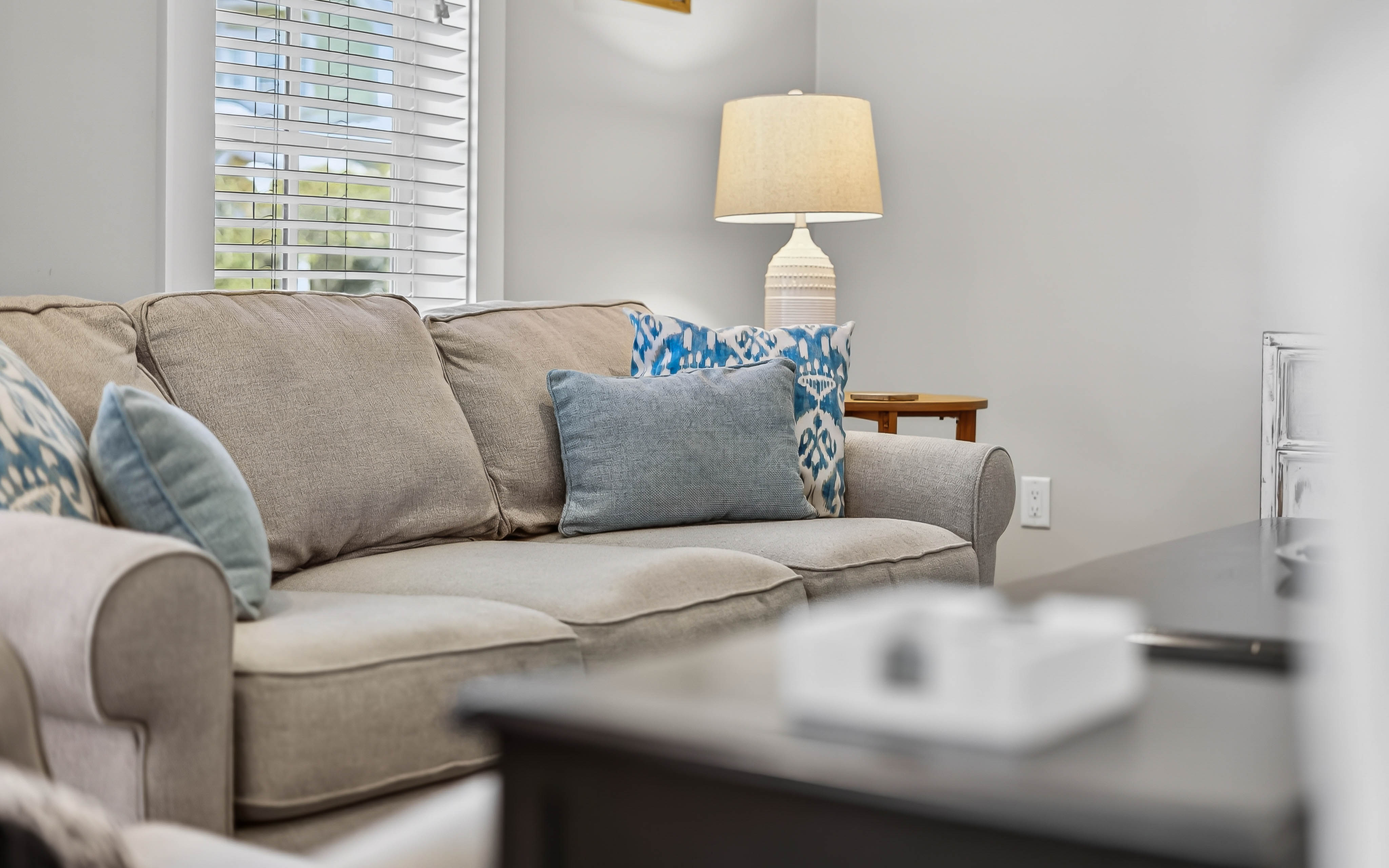 Sink into this plush sofa with your favorite book, surrounded by thoughtful touches that make this space feel like home.