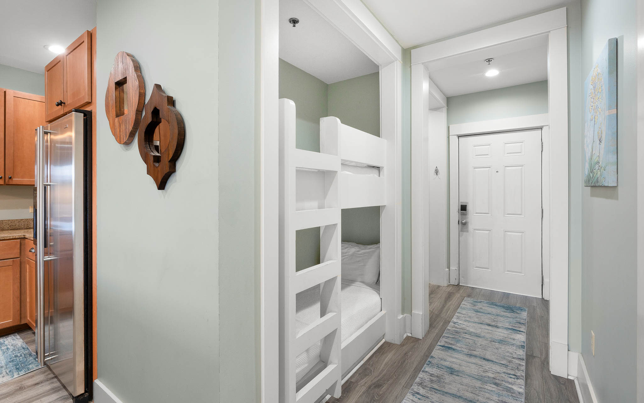 Your kids will love these stylish bunk beds tucked into this cozy nook, creating the perfect sleeping adventure.
