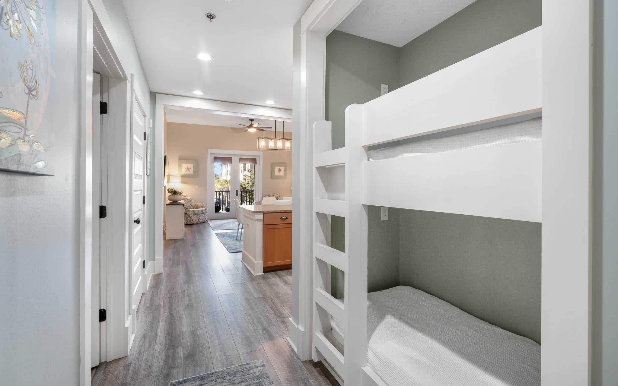 Rest peacefully in your private bunk room featuring modern built-in beds with crisp linens and calming gray tones.