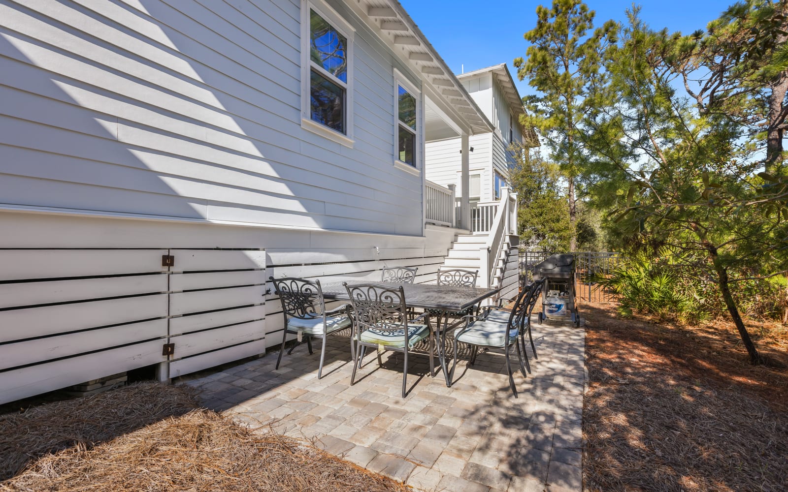 Your private patio offers the perfect spot for morning coffee or evening gatherings under dappled shade.