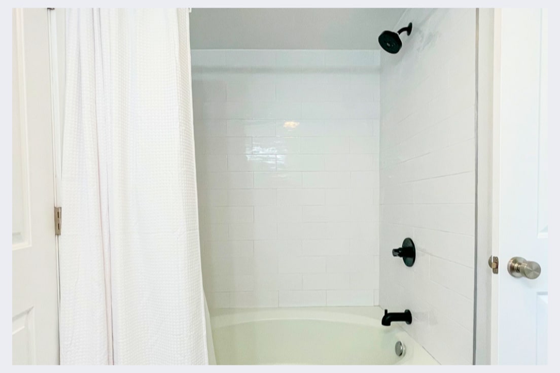 Your private bathroom features a clean tub-shower combo with modern fixtures, perfect for unwinding after your adventures.