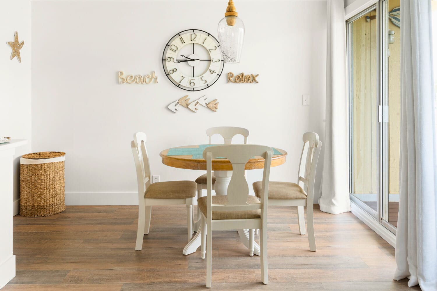 Gather around your coastal dining table where beach-themed wall art sets the perfect mood for memorable meals together.