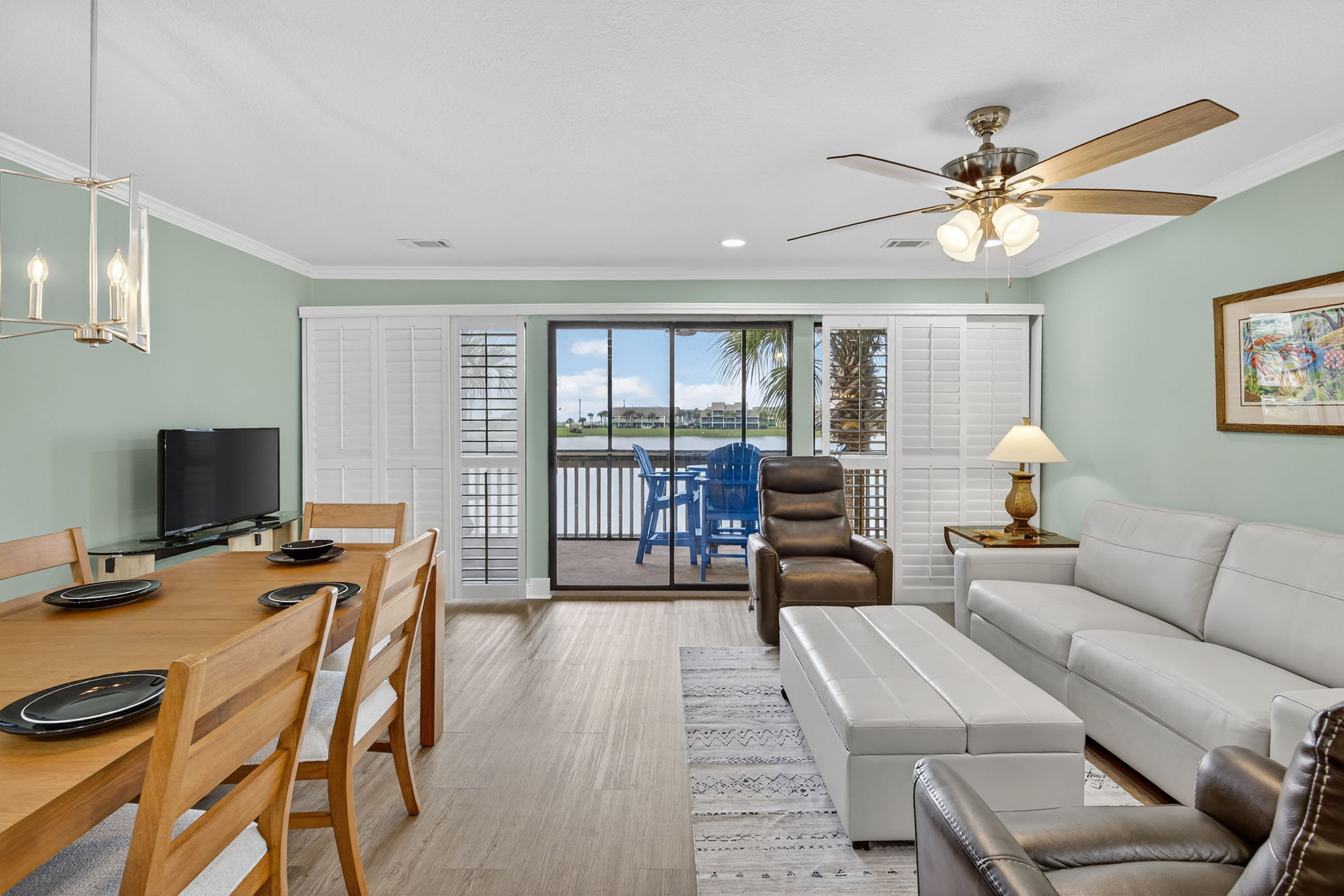 Relax in your bright, airy living space with comfortable seating, dining for six, and sliding doors that open to your private waterfront balcony.