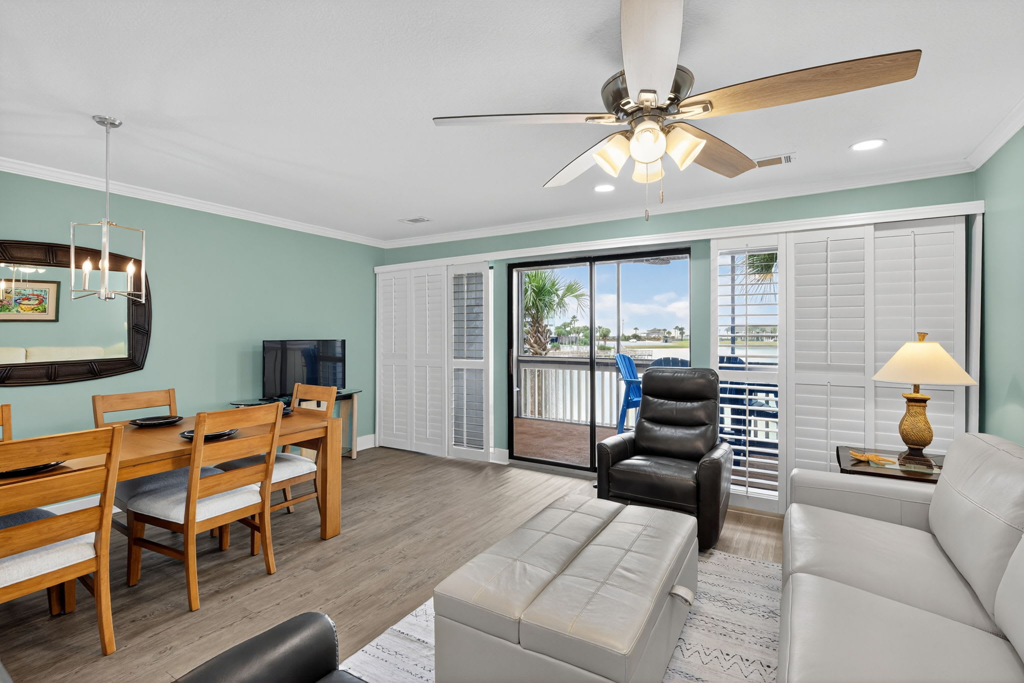Relax in your modern living space with coastal views from your private balcony, complete with comfortable seating and dining area for memorable vacation moments.