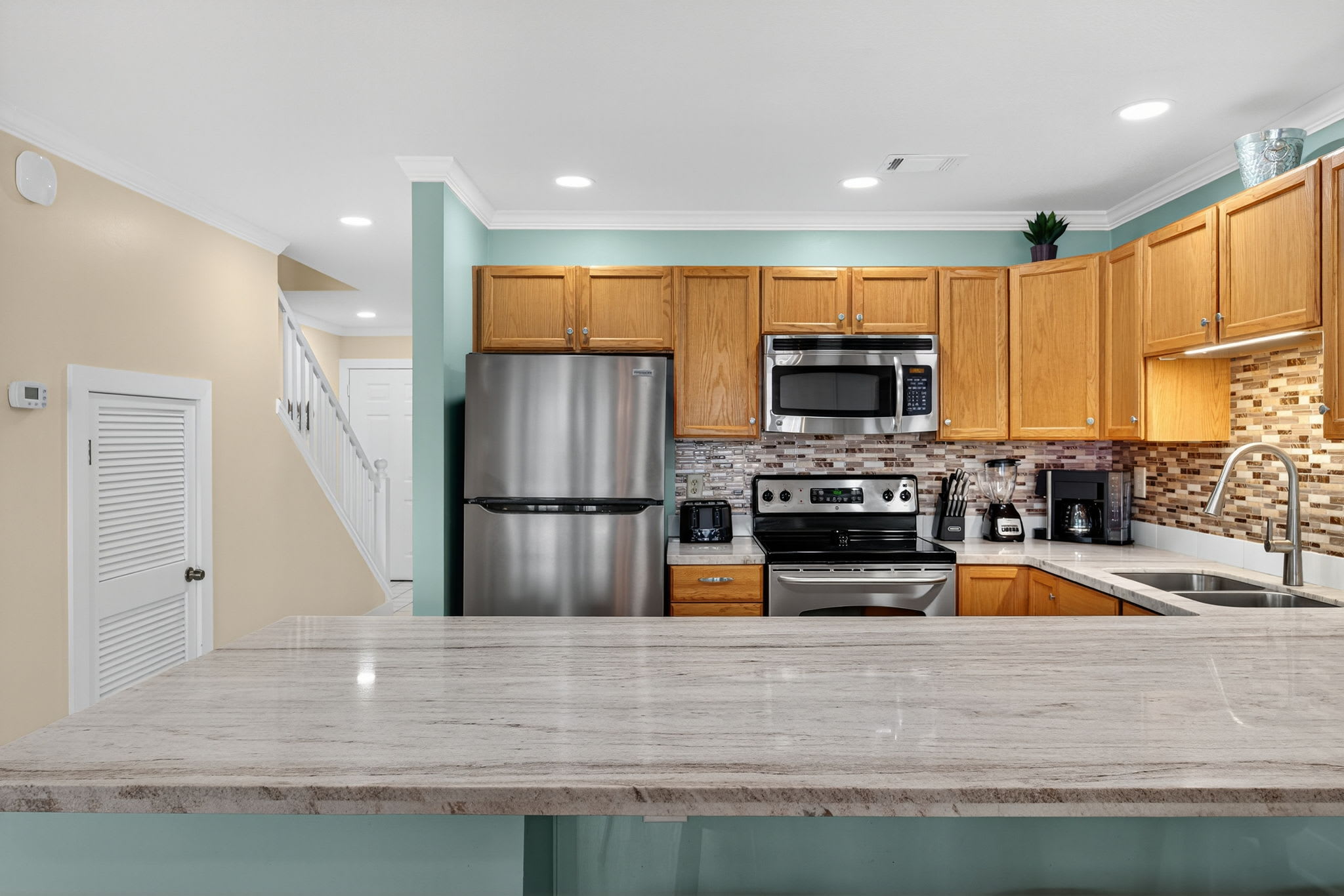 Your fully equipped kitchen features stainless steel appliances, granite countertops, and everything you need to prepare meals during your stay.