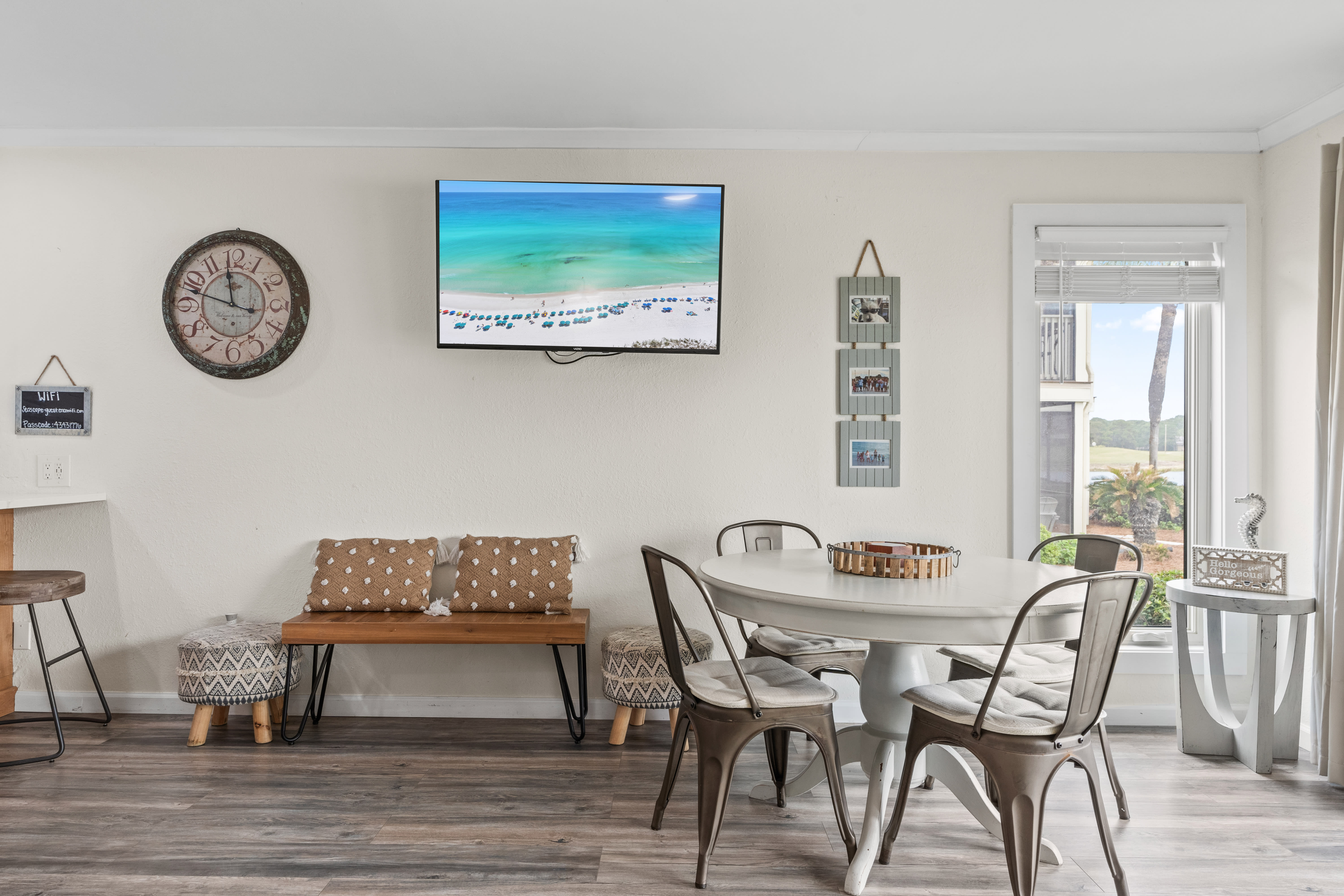 Gather around your stylish dining table while enjoying the large TV and beautiful natural light streaming through your windows.