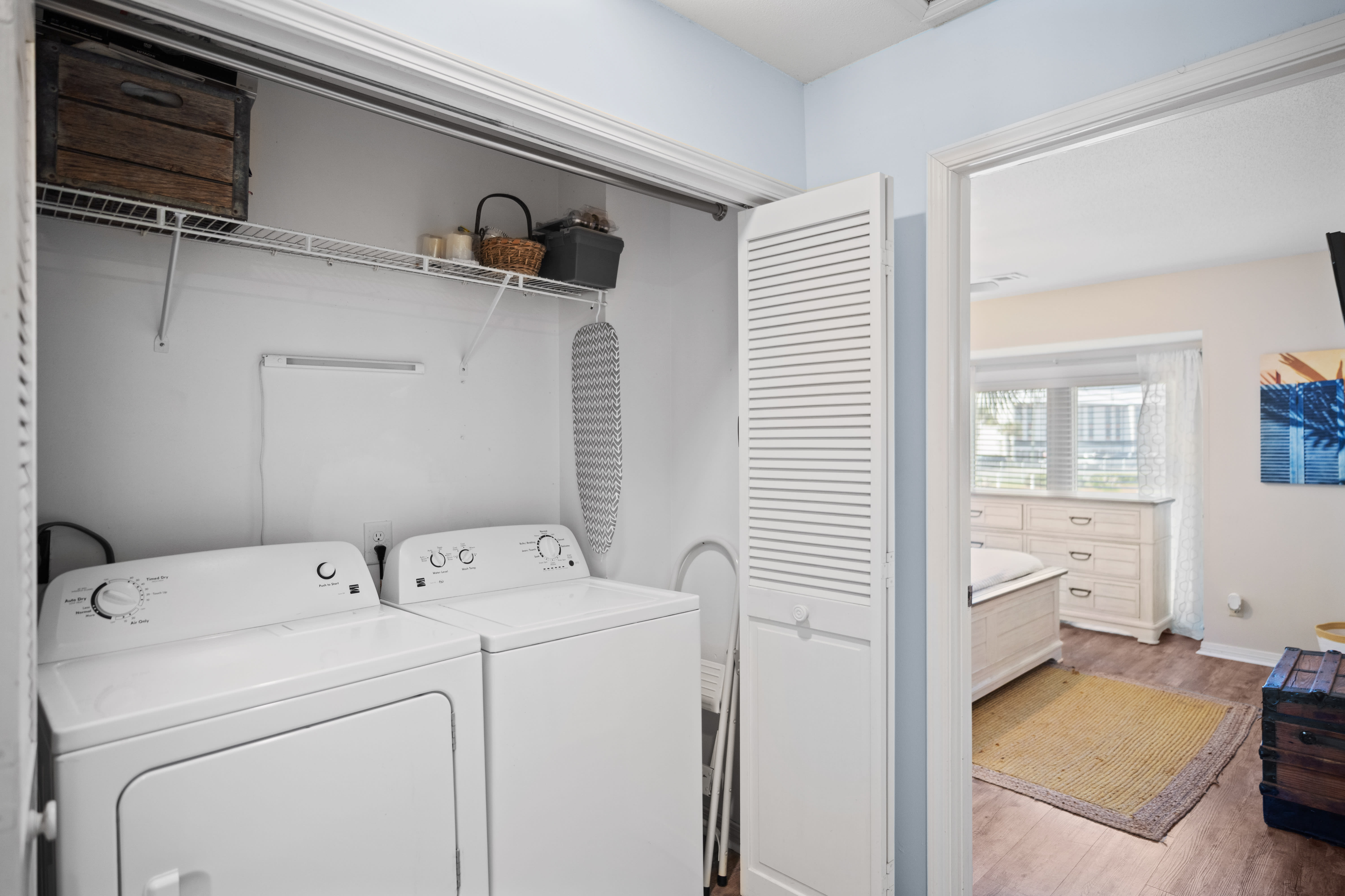 Convenient laundry closet with a full-size washer and dryer.