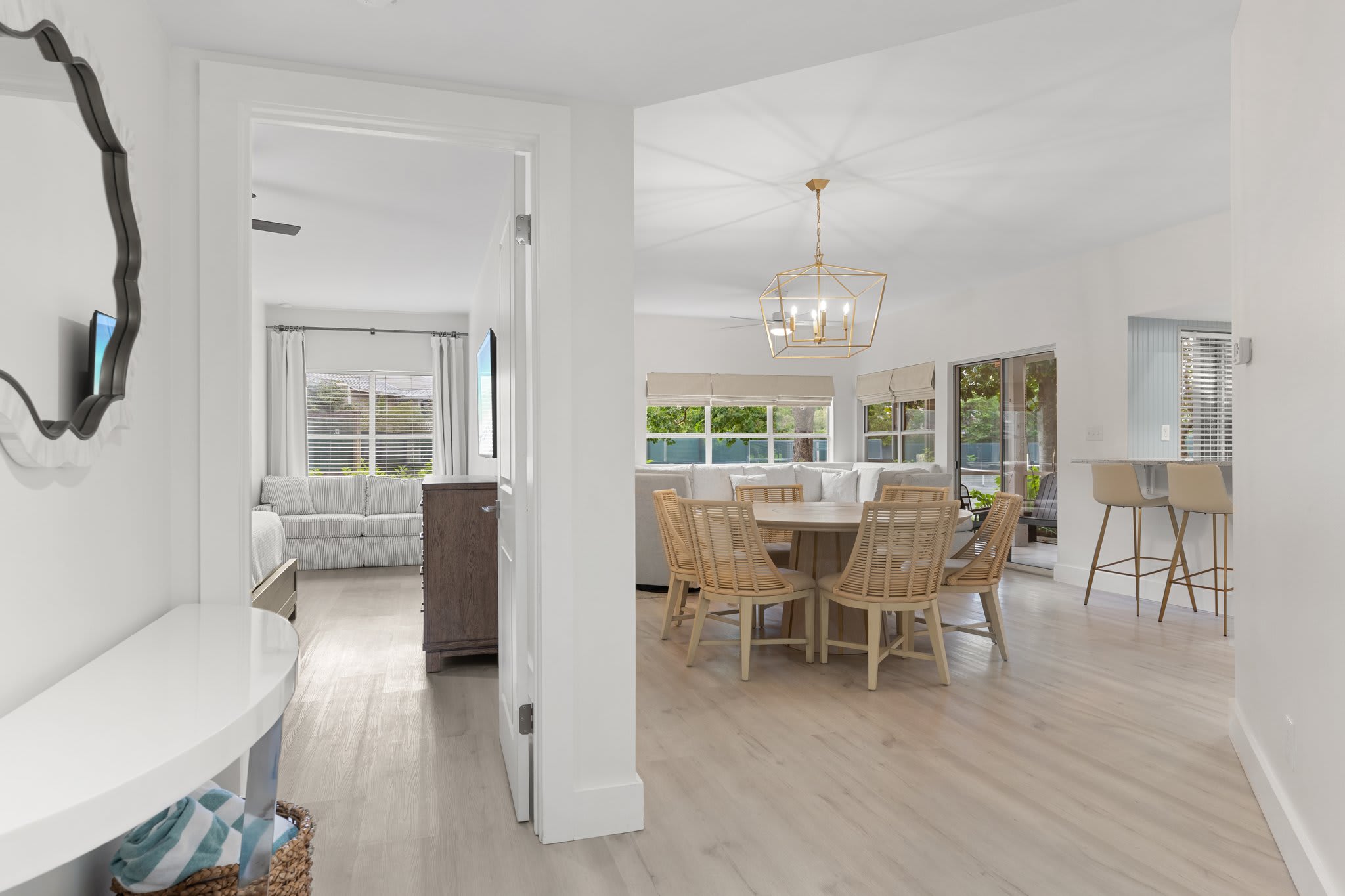 Sunlight pours into this open, coastal-inspired space featuring natural textures and breezy elegance.