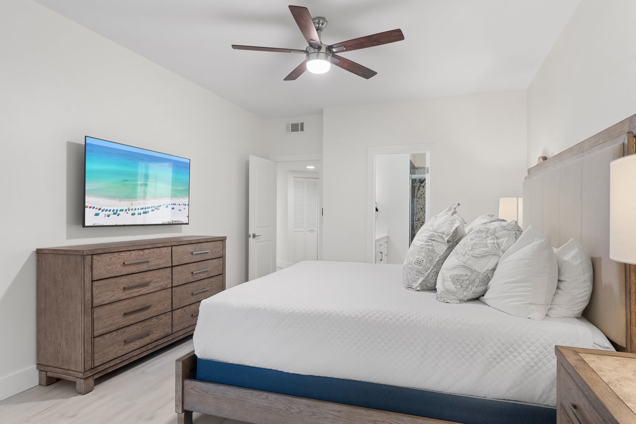 Enjoy restful nights in this calming bedroom retreat with a king bed, queen sleeper sofa, flat-screen TV, and a private en-suite bathroom.