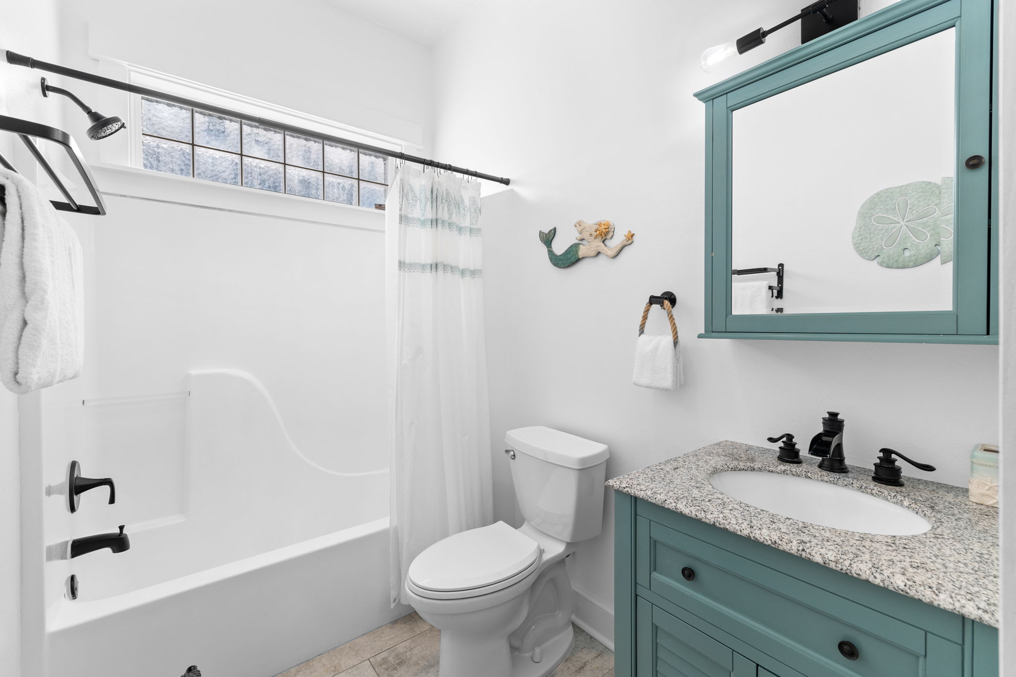 Shared Guest Bathroom - Single Vanity + Shower/Tub Combo