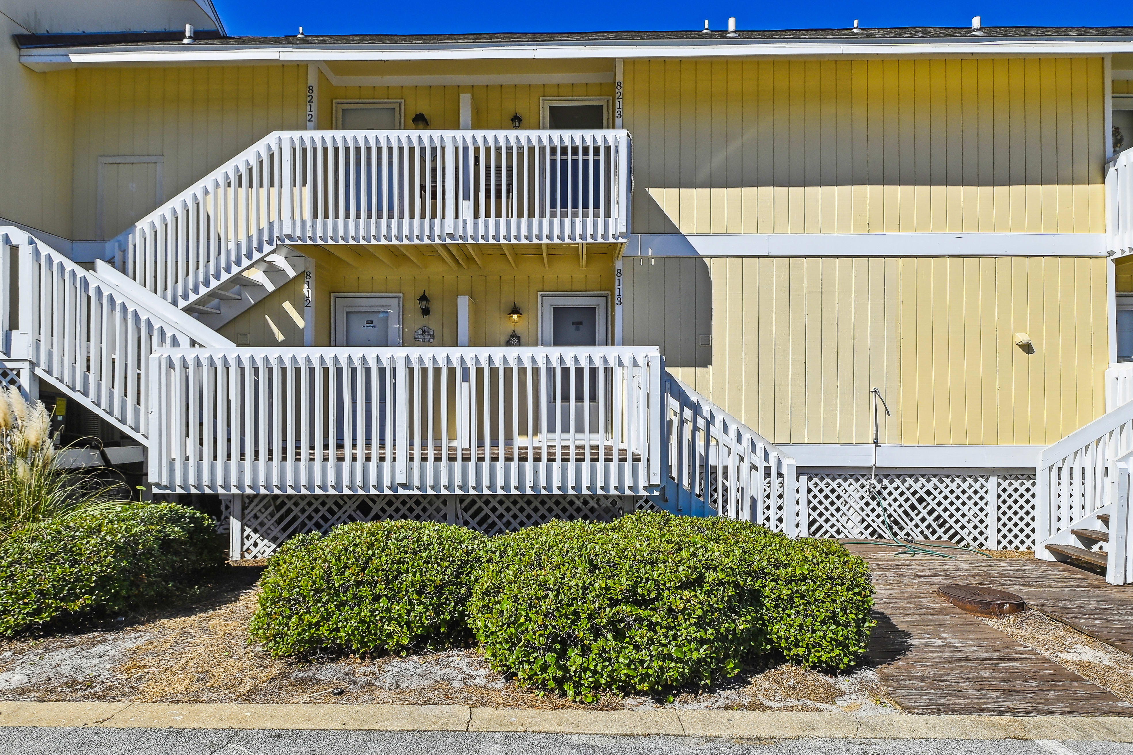 Front of condo. Steps leading to front door
