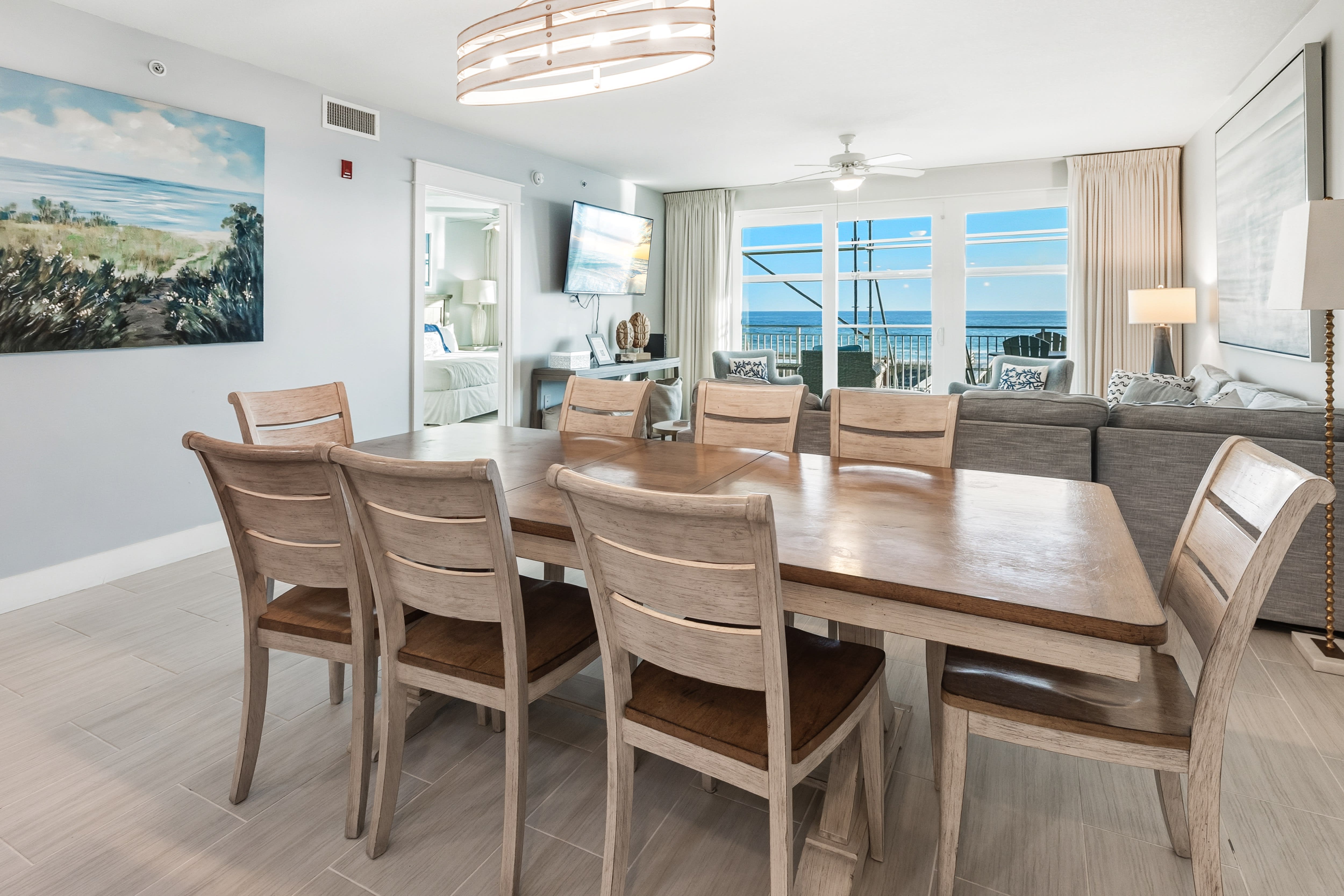 Gather around your elegant dining table for eight, where ocean breezes flow through and stunning sea views create the perfect backdrop for memorable meals.